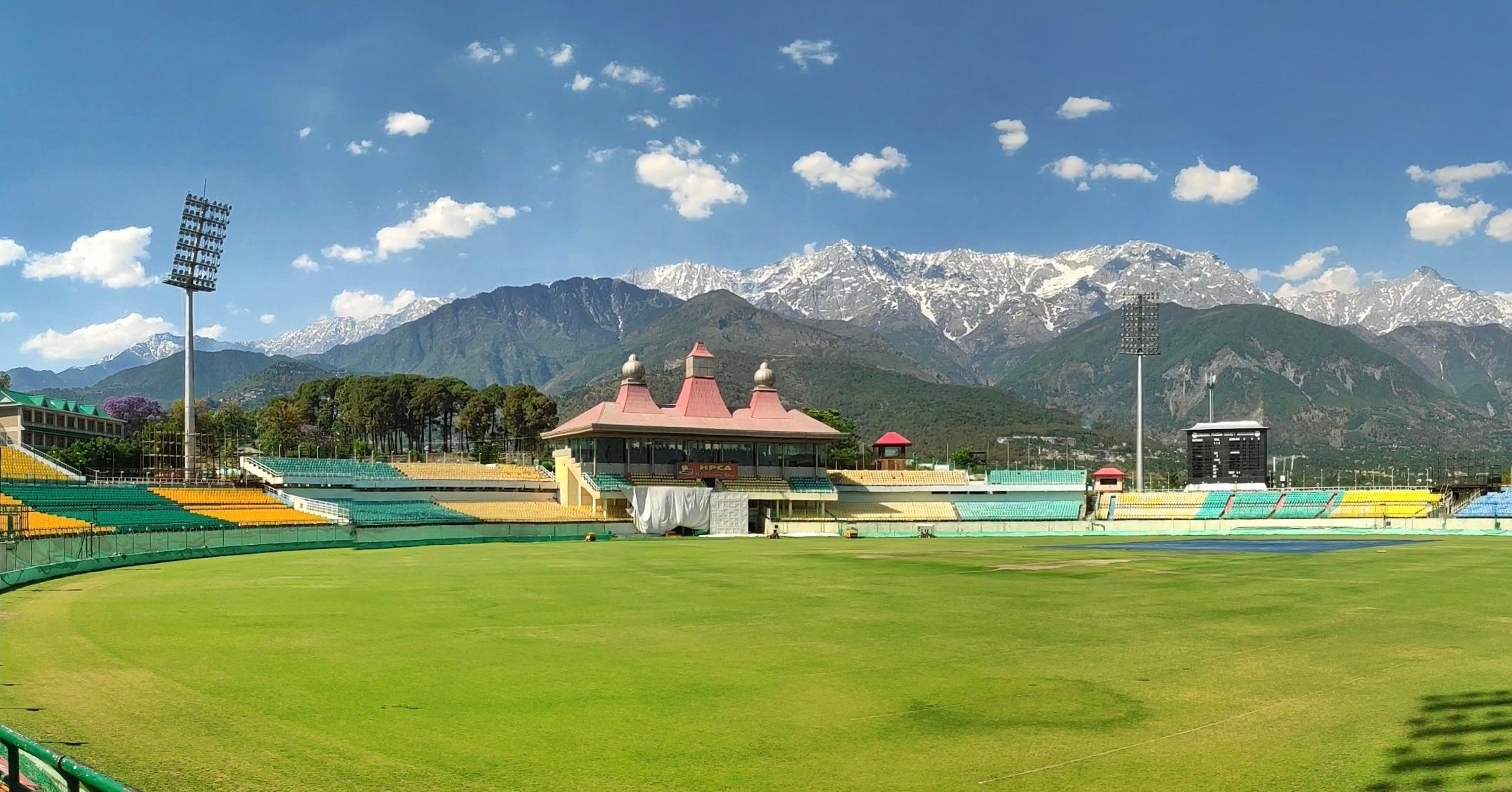 HPCA stadium in dharamshala with snow covered moutnains in the background
