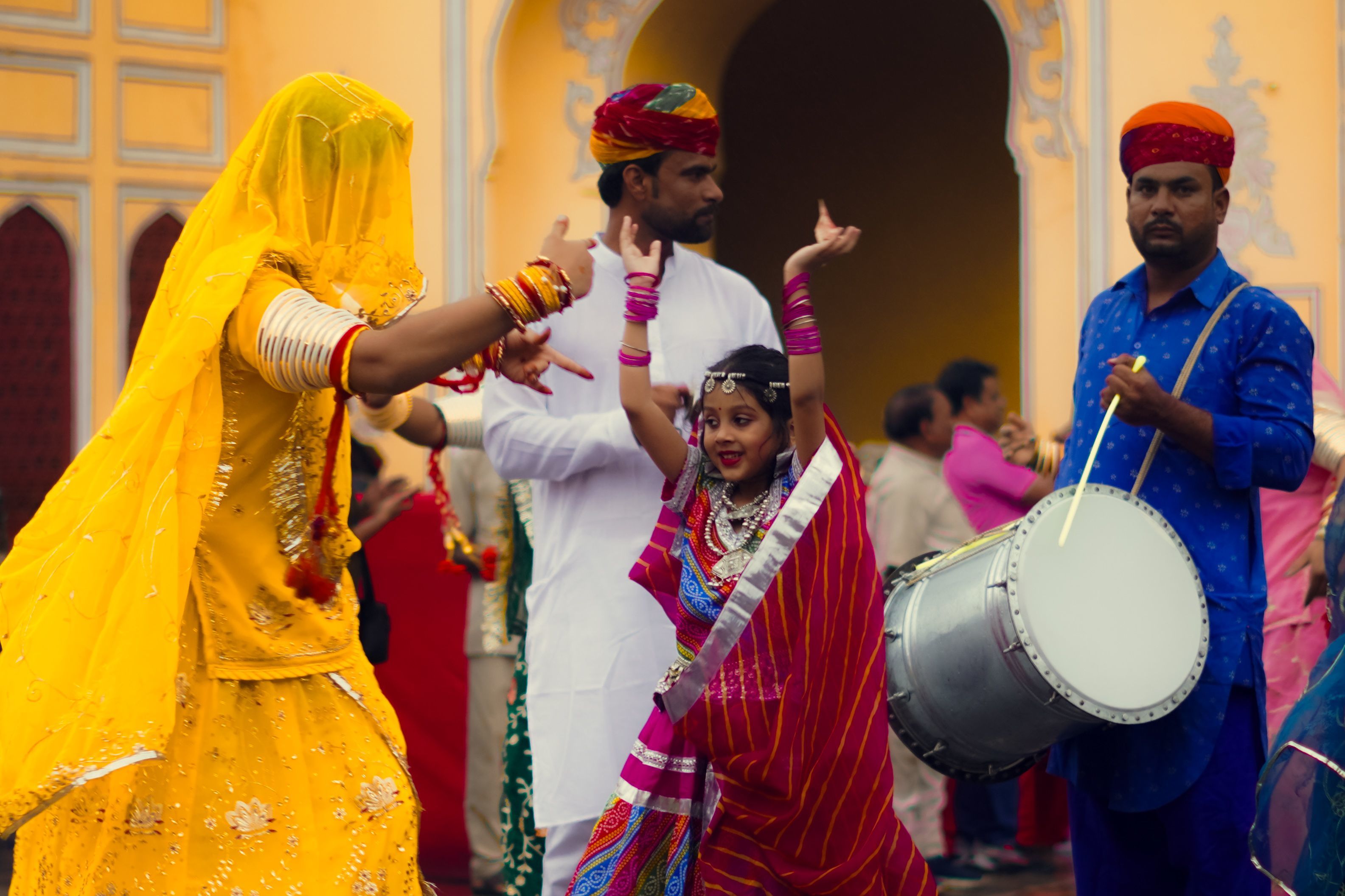 a girl and a woman dancing on a cultural music in rajasthan