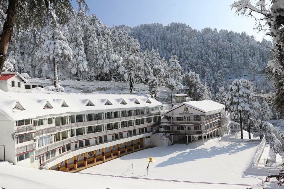 a building covered in snow near banikhet during winter