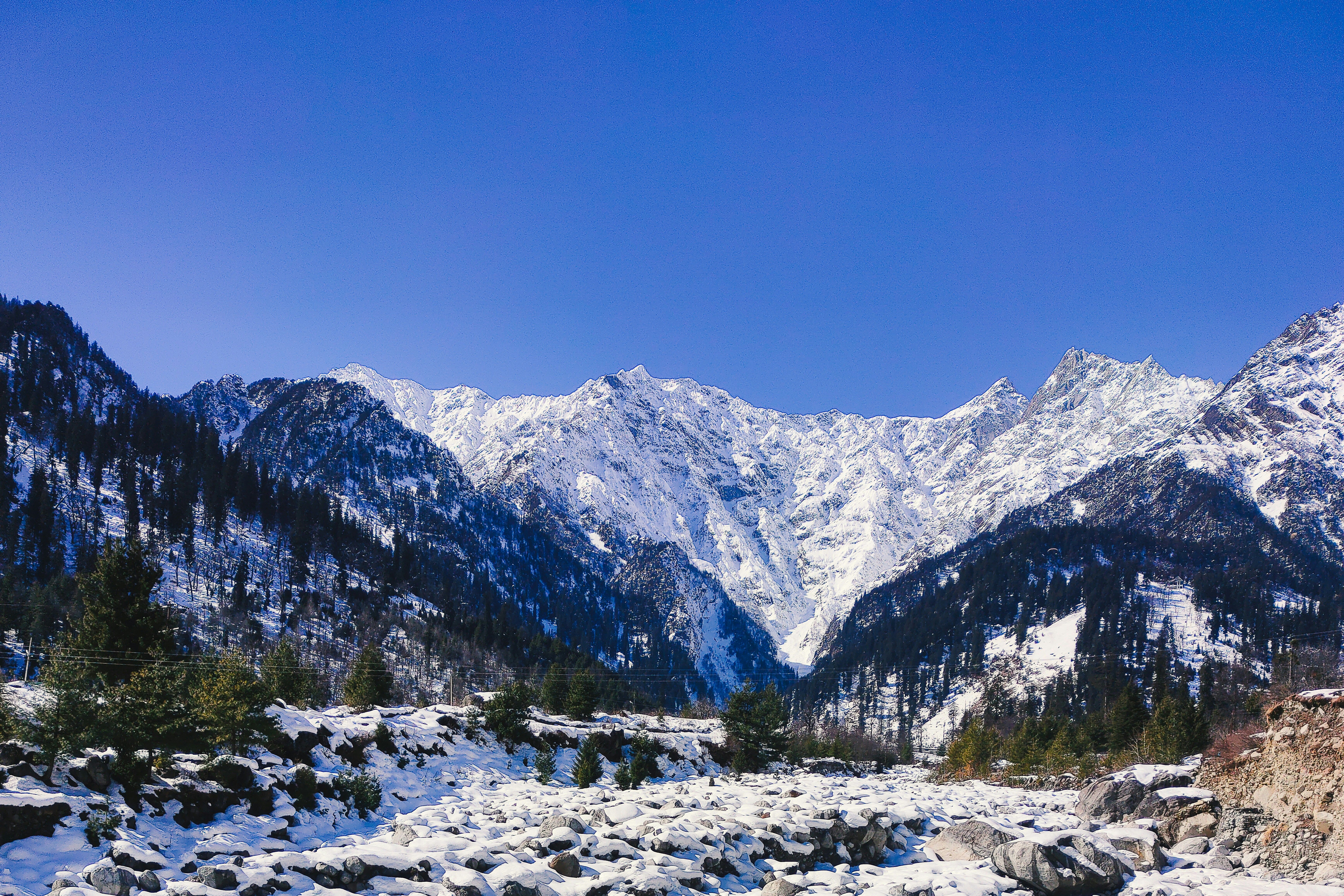 a snow covered field in solang valley near manali