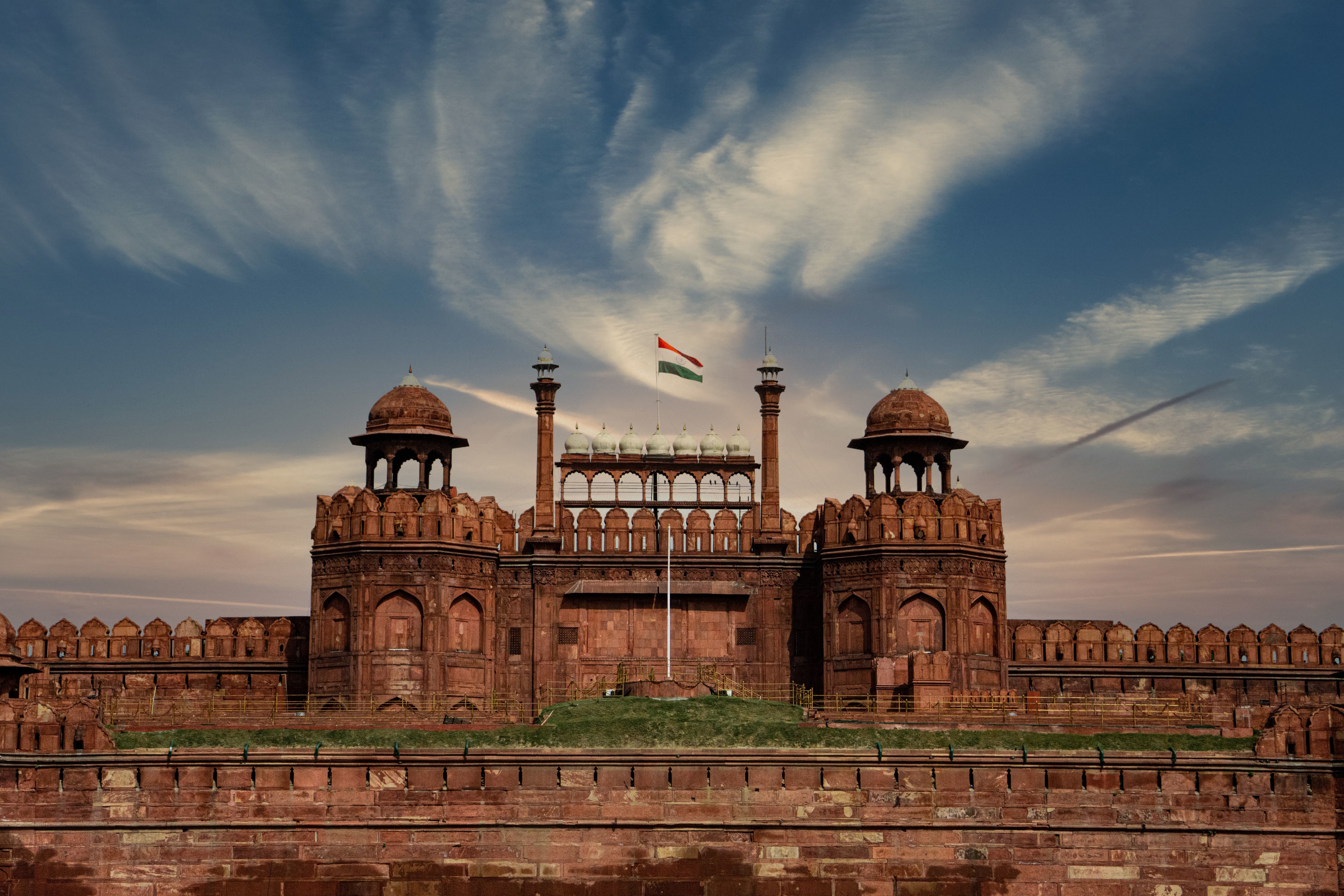 stunning view of the red fort in new delhi shocasing its historic architecture and indian flags