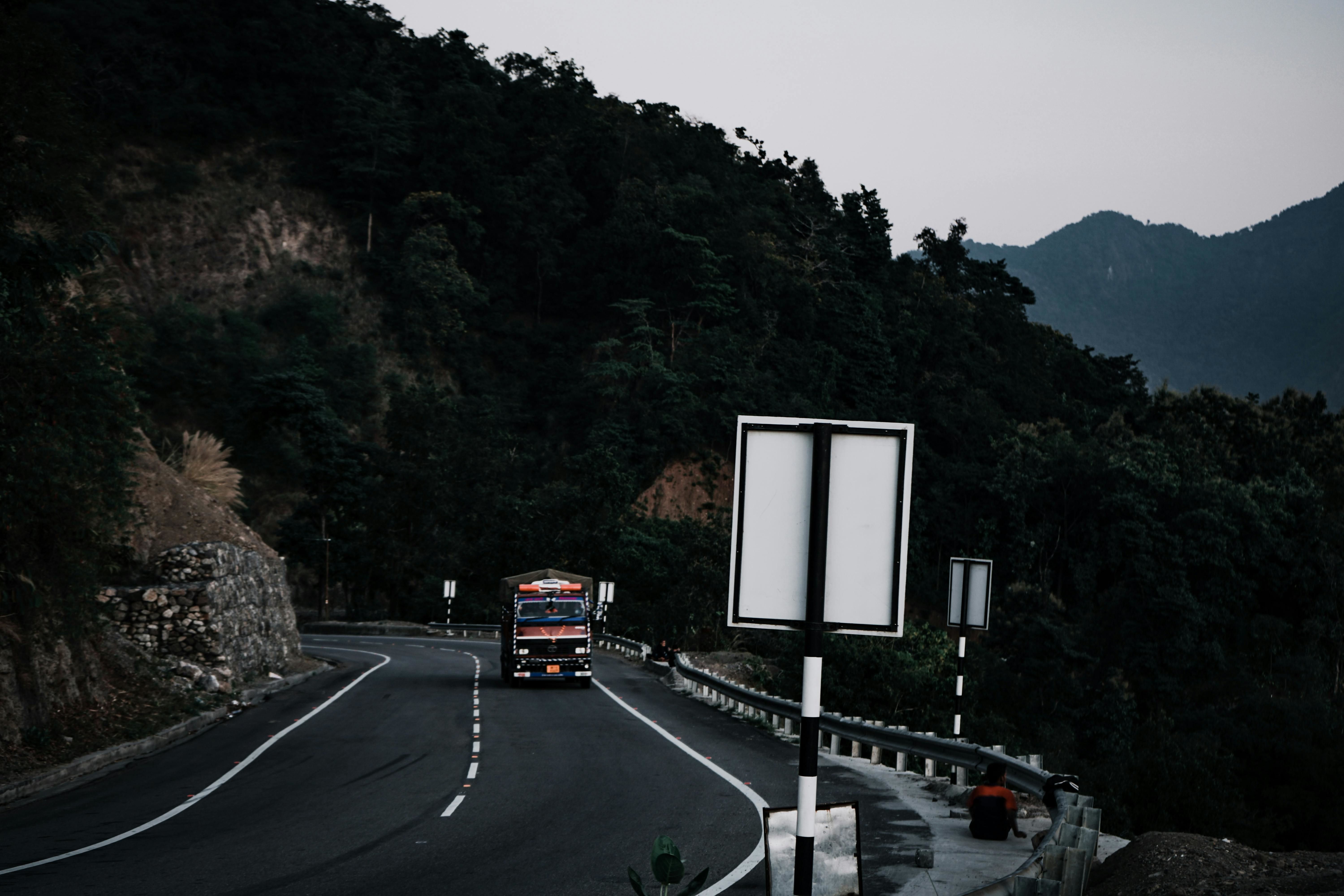a truck on the road in himachal pradesh during evening