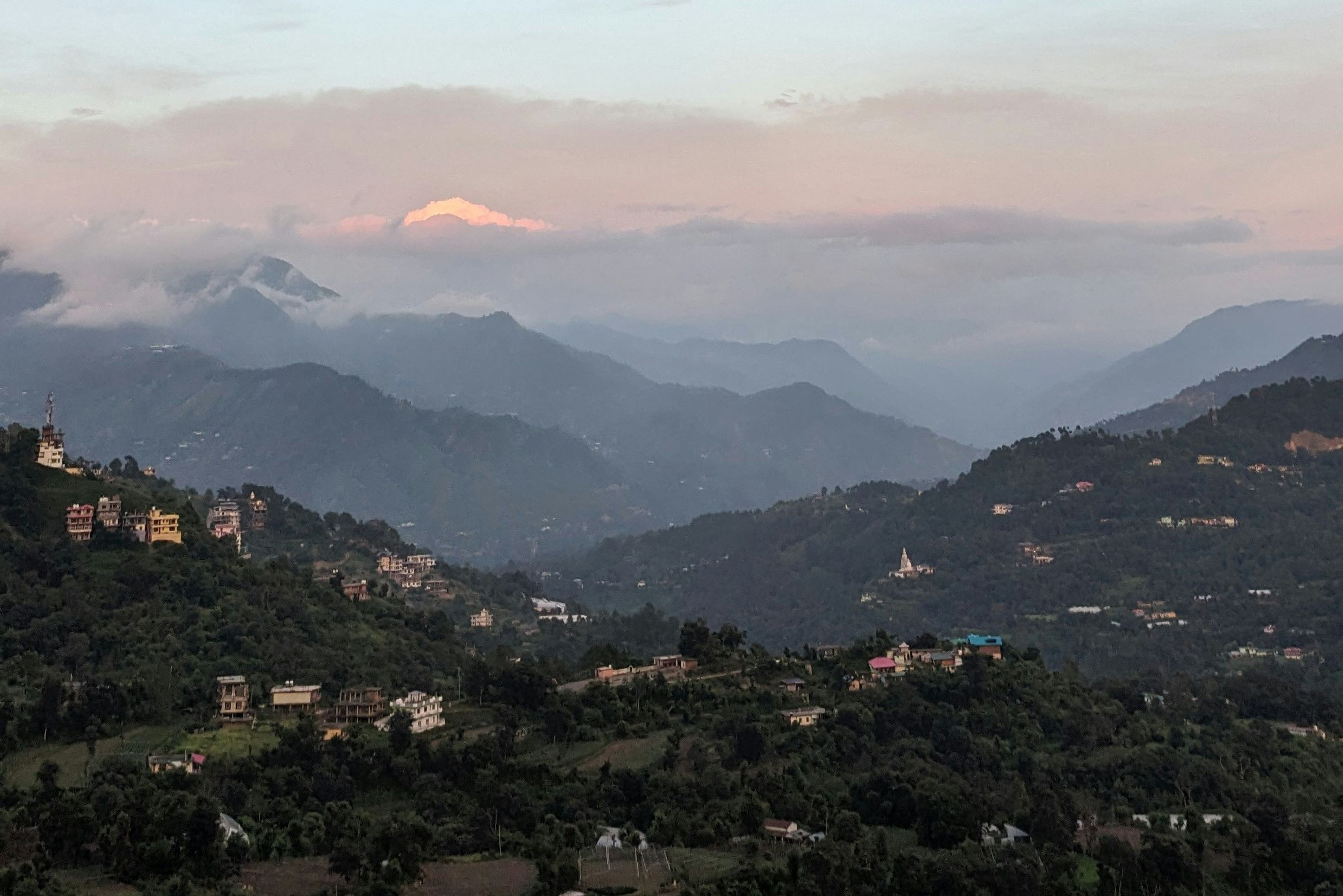 a view of mountain range with cloudy sky in solan