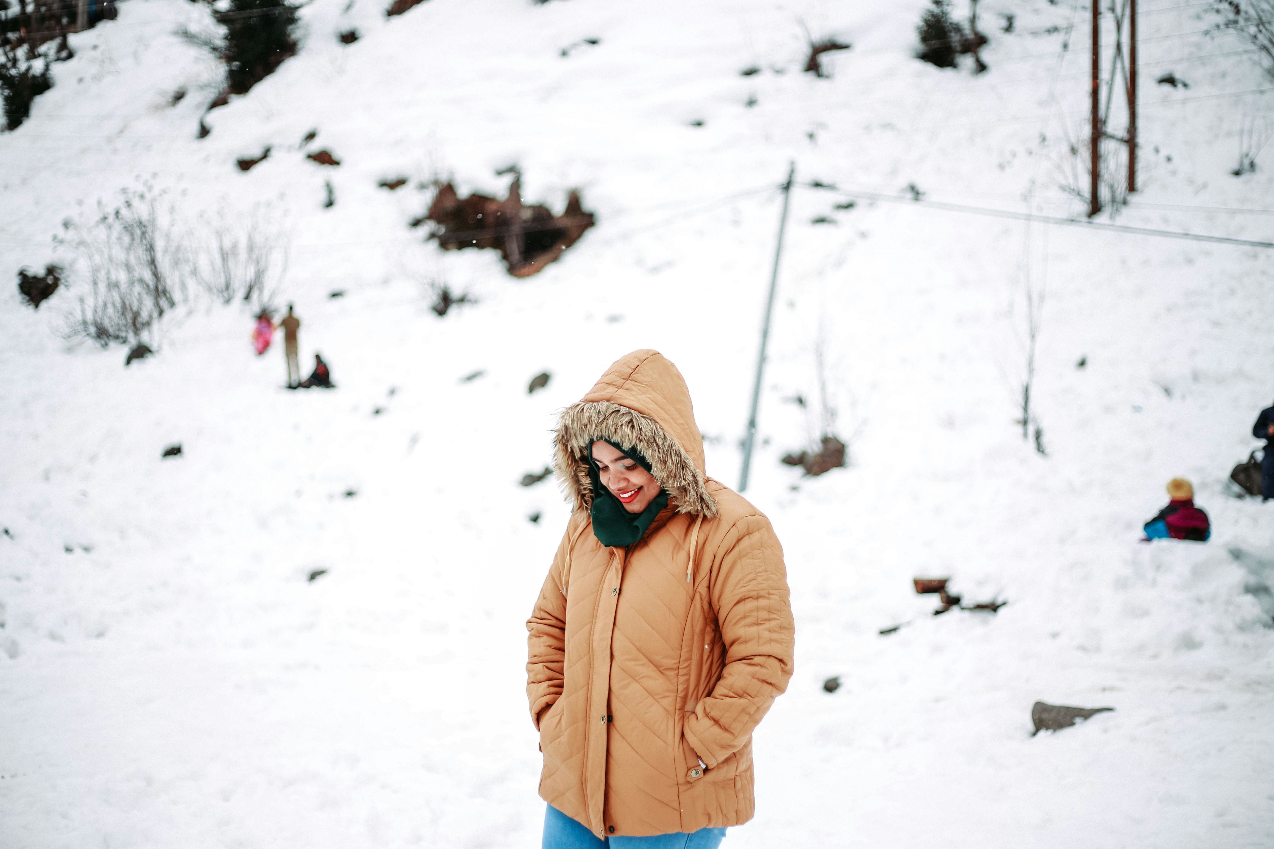 a woman standing on snow