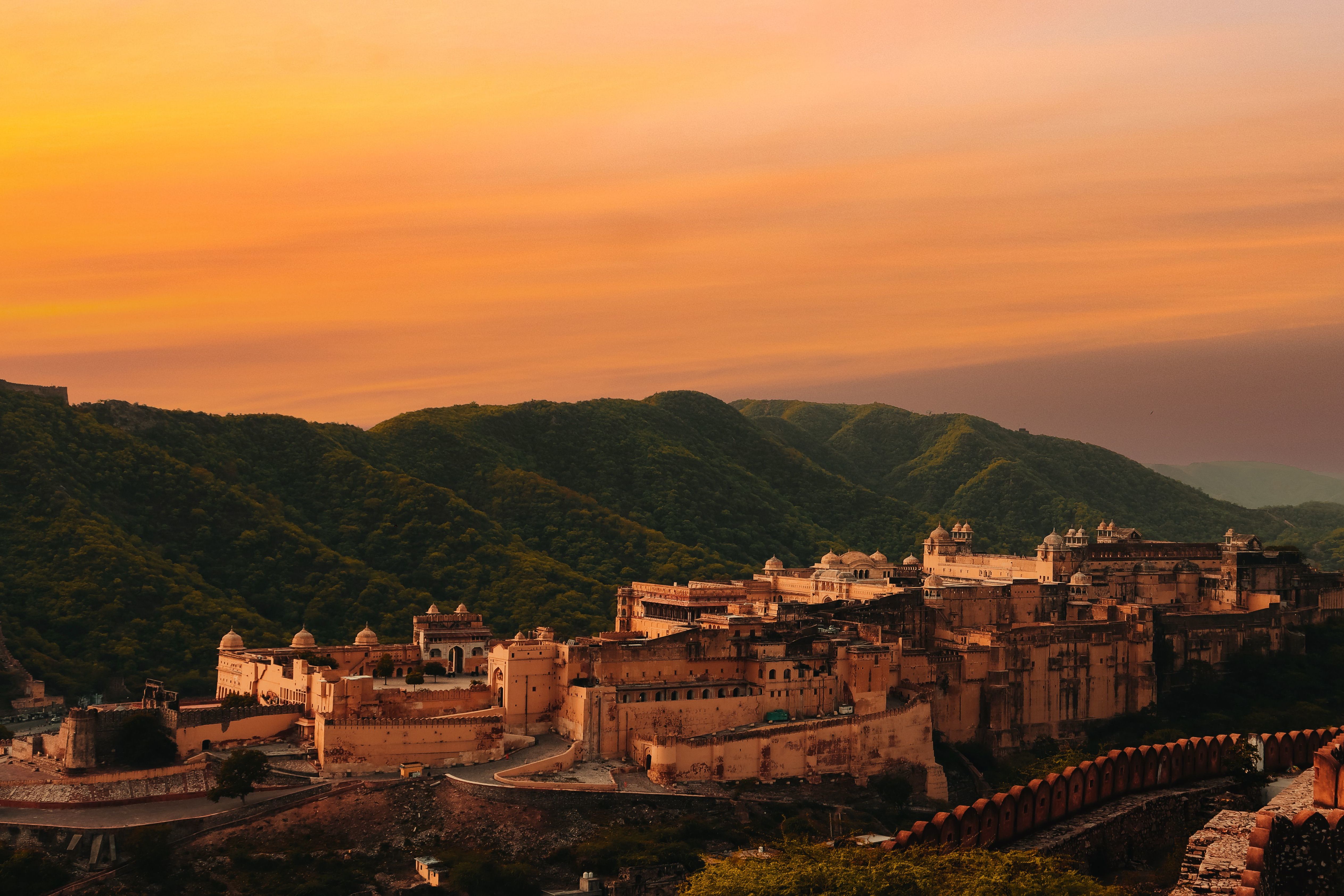 aerial shot of amber fort in jaipur during sunset with vibrant sky