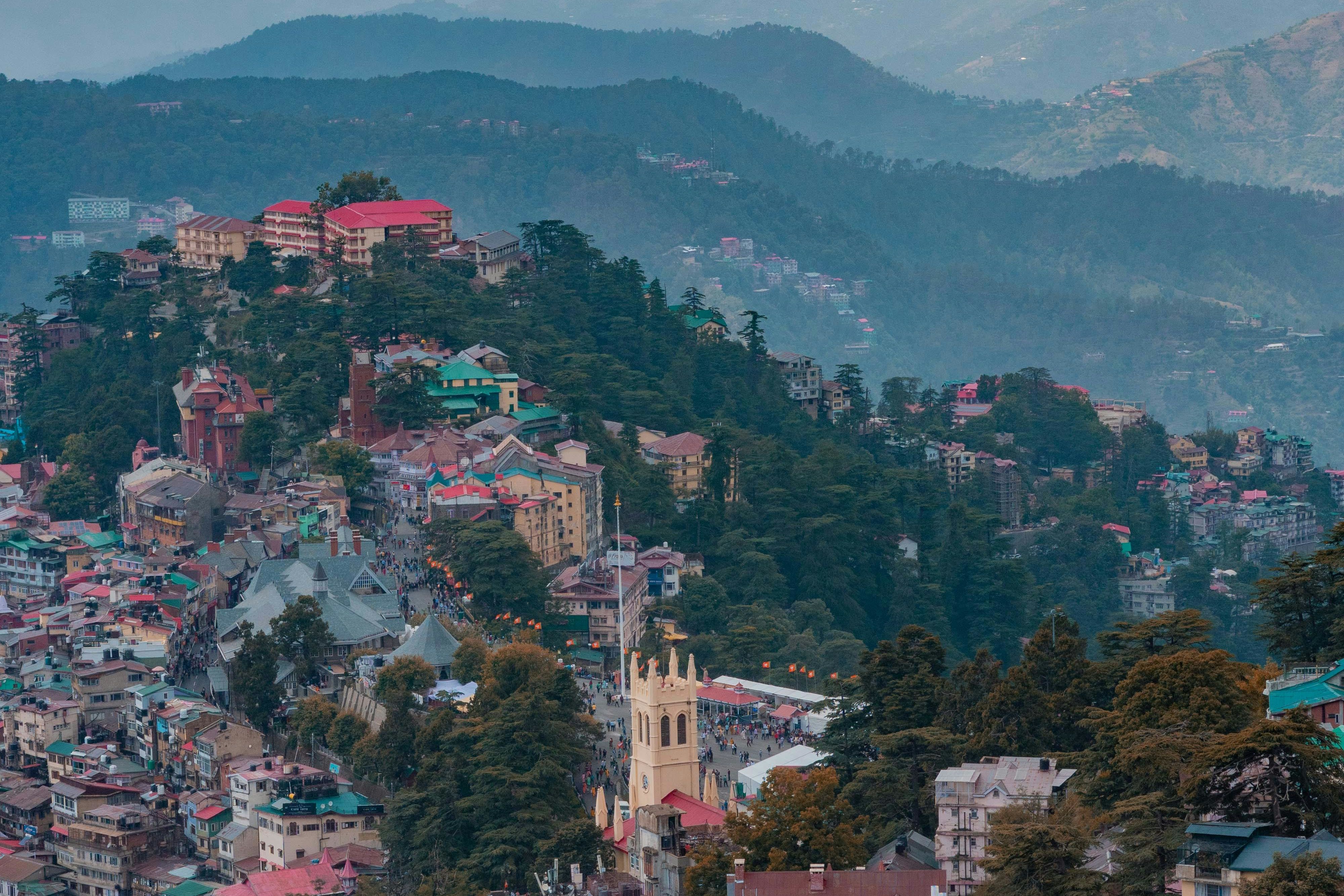 aerial view of a village near the mountain in shimla
