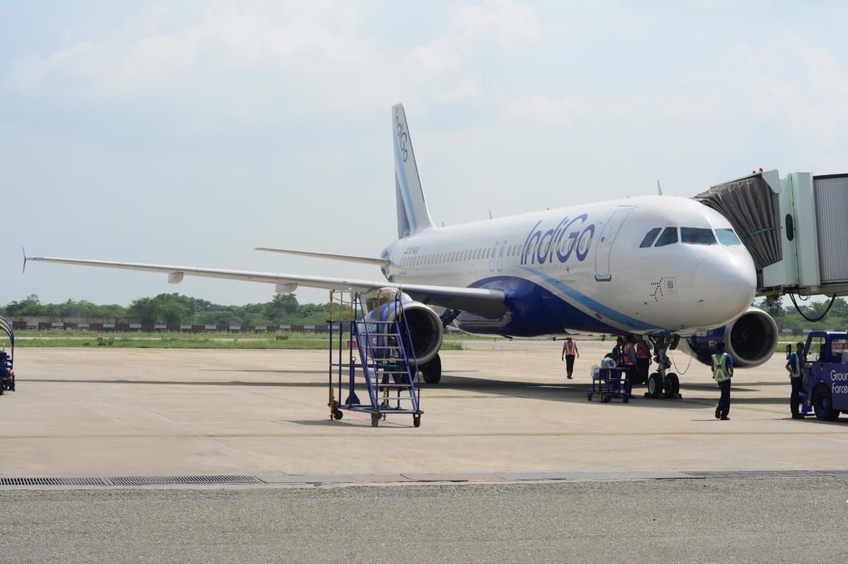 an aeroplane standing at udaipurs maharana pratap airport during daytime