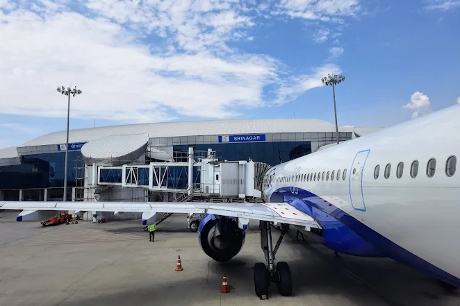 an aeroplane standing at srinagar international airport