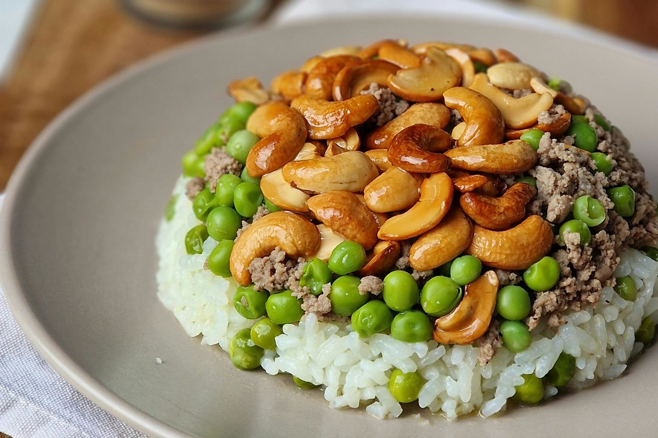 rice dish with cashews and peas