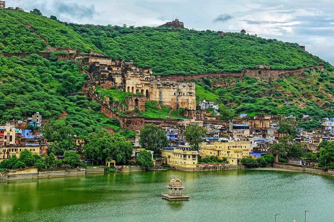 view of bundi palace with green mountains in the backdrop in bundi rajasthan