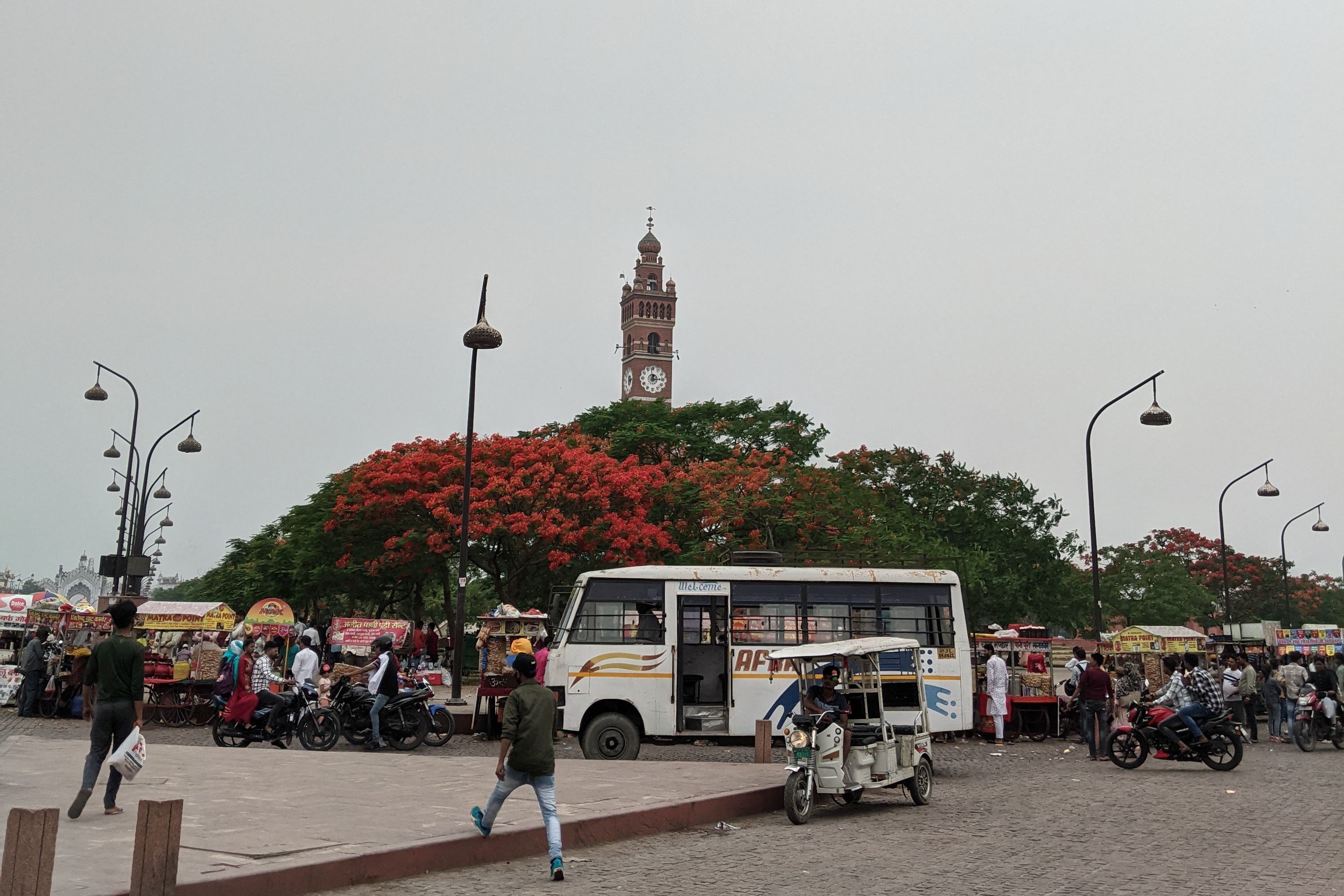 bustling street at historic clock tower in jodhpur