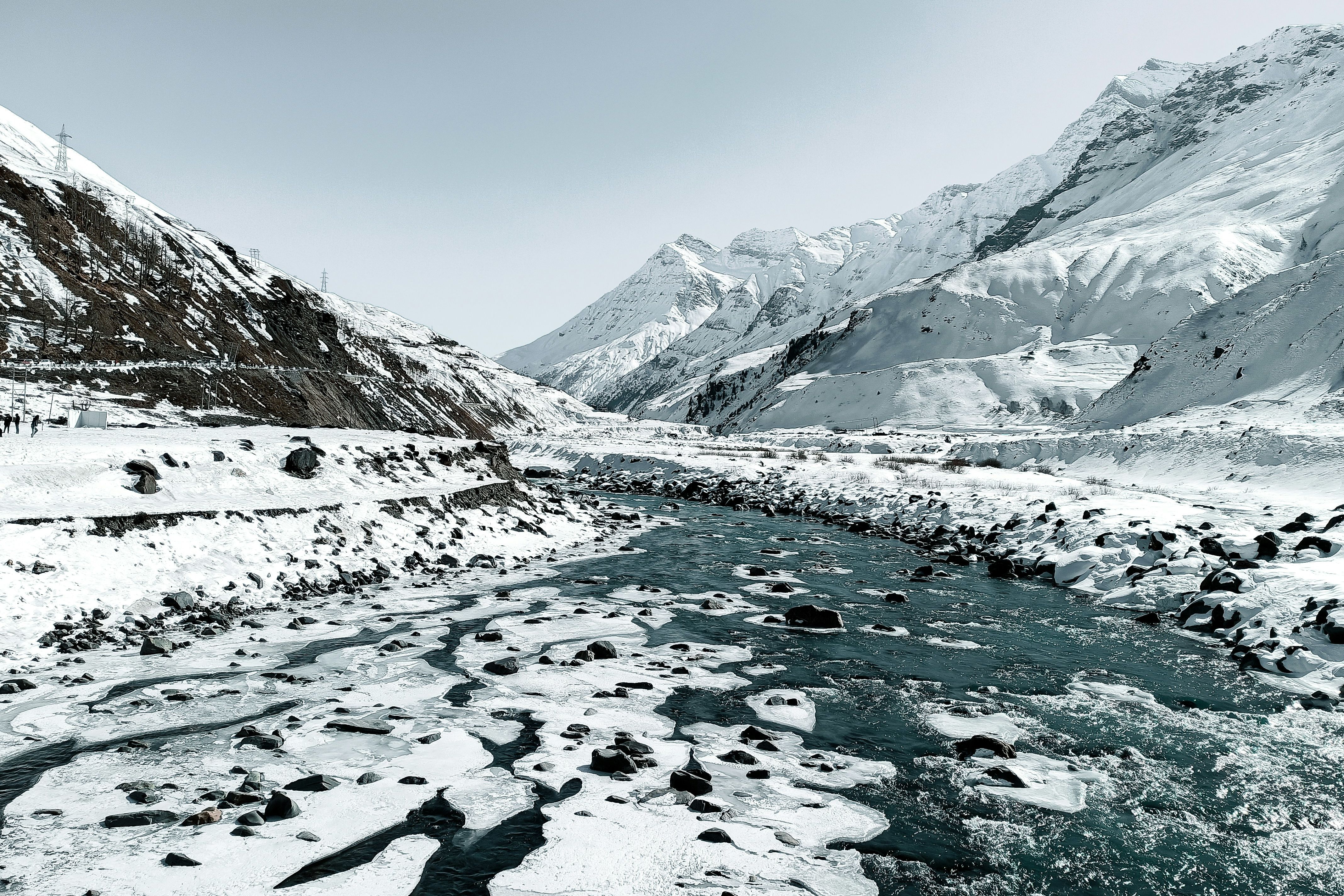 chandra river flowing through a snow covered mountain valley near sissu in himachal pradesh
