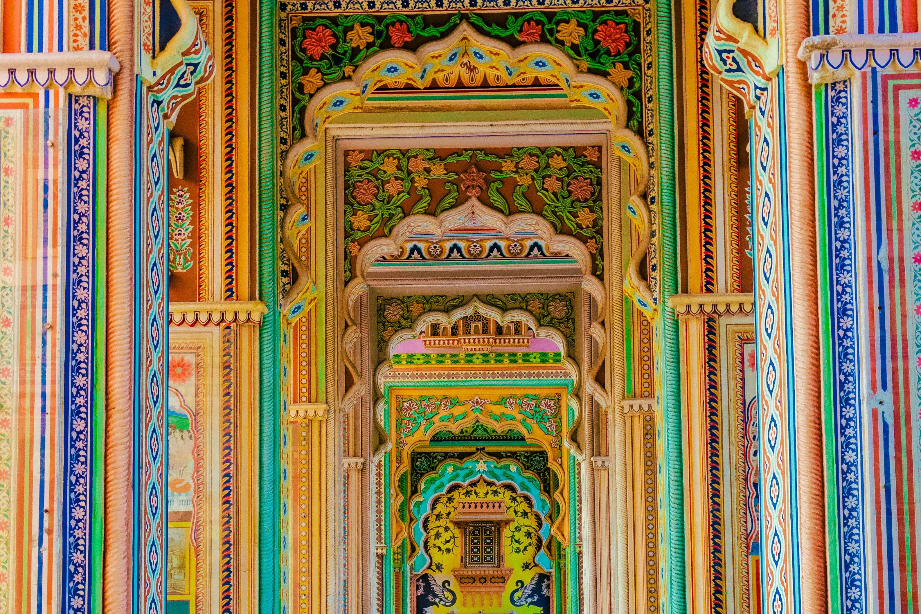 colorful patrika gate building with columns and tiled floor at jaipur