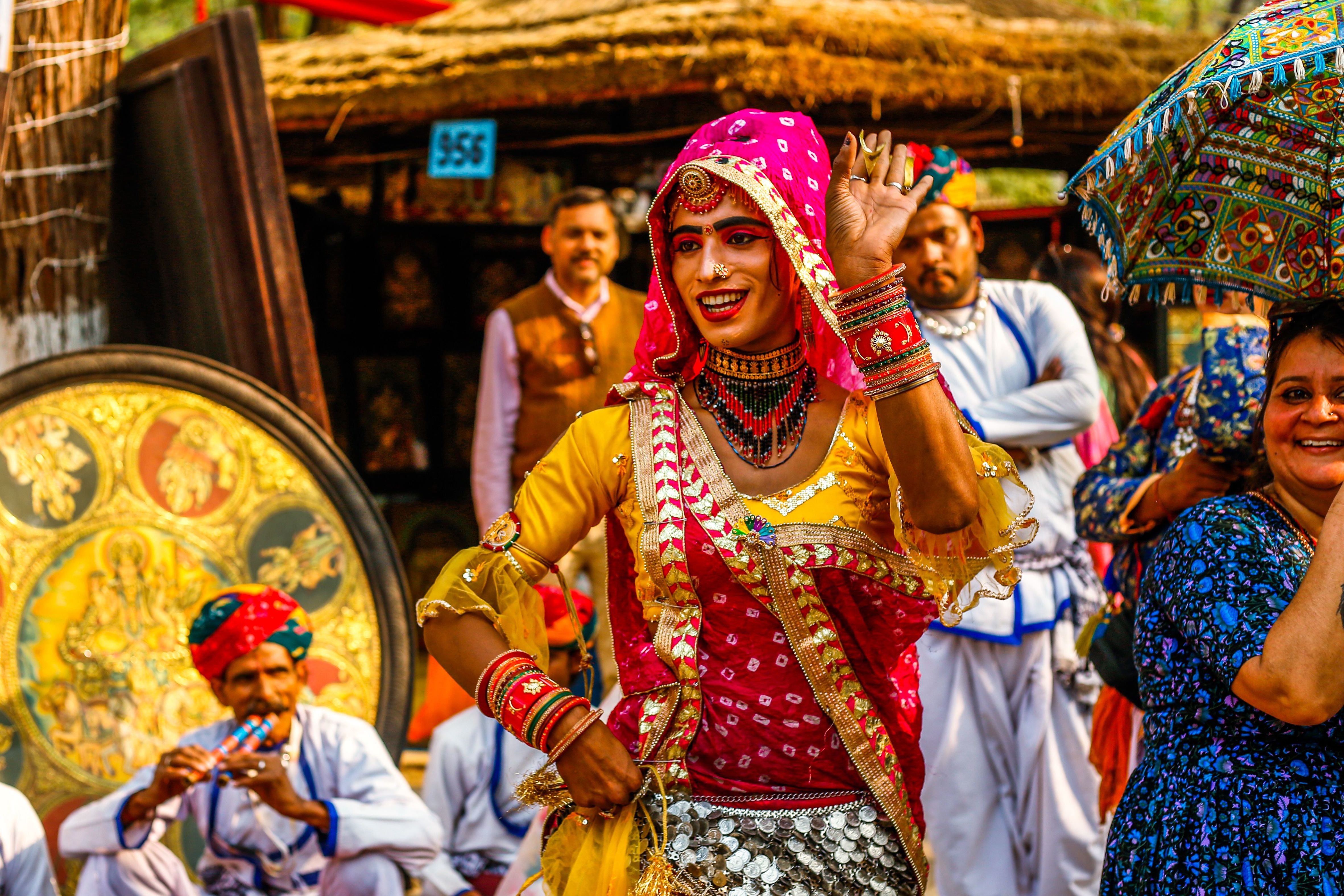 colorful rajasthani dancers in traditional attire at a cultural festival