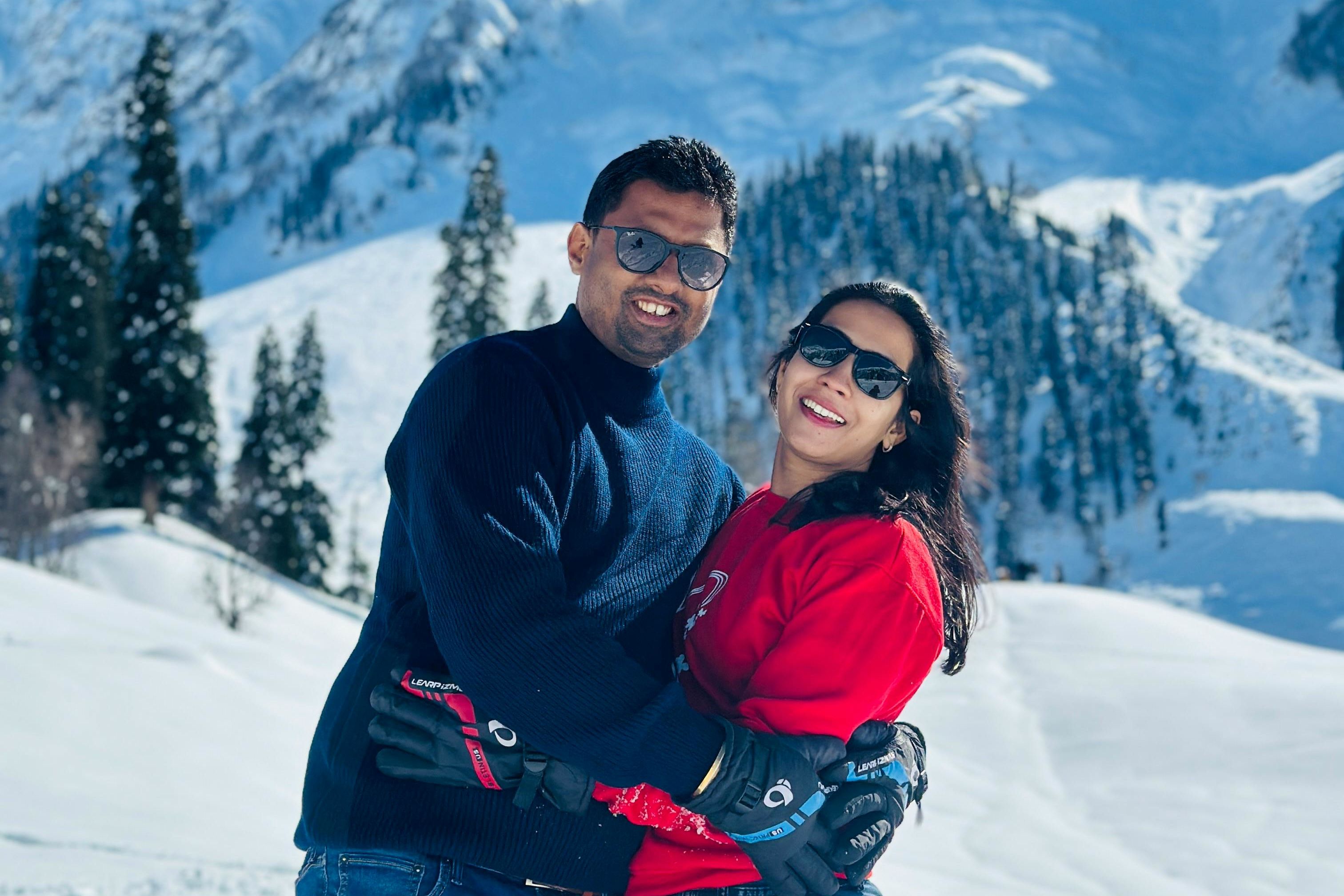 couple enjoying snowy mountains