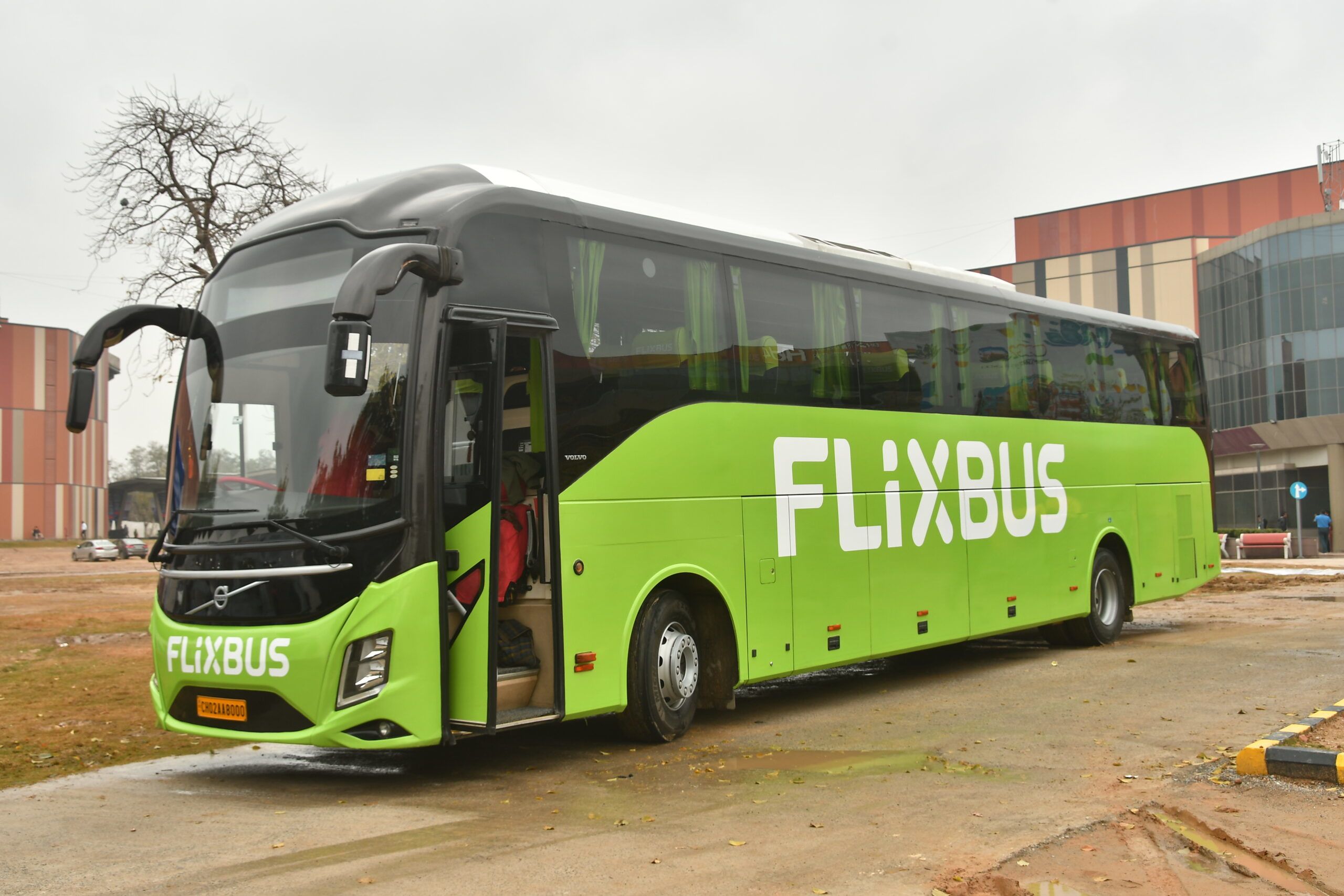 a green volvo bus plying in between delhi and dharamshala
