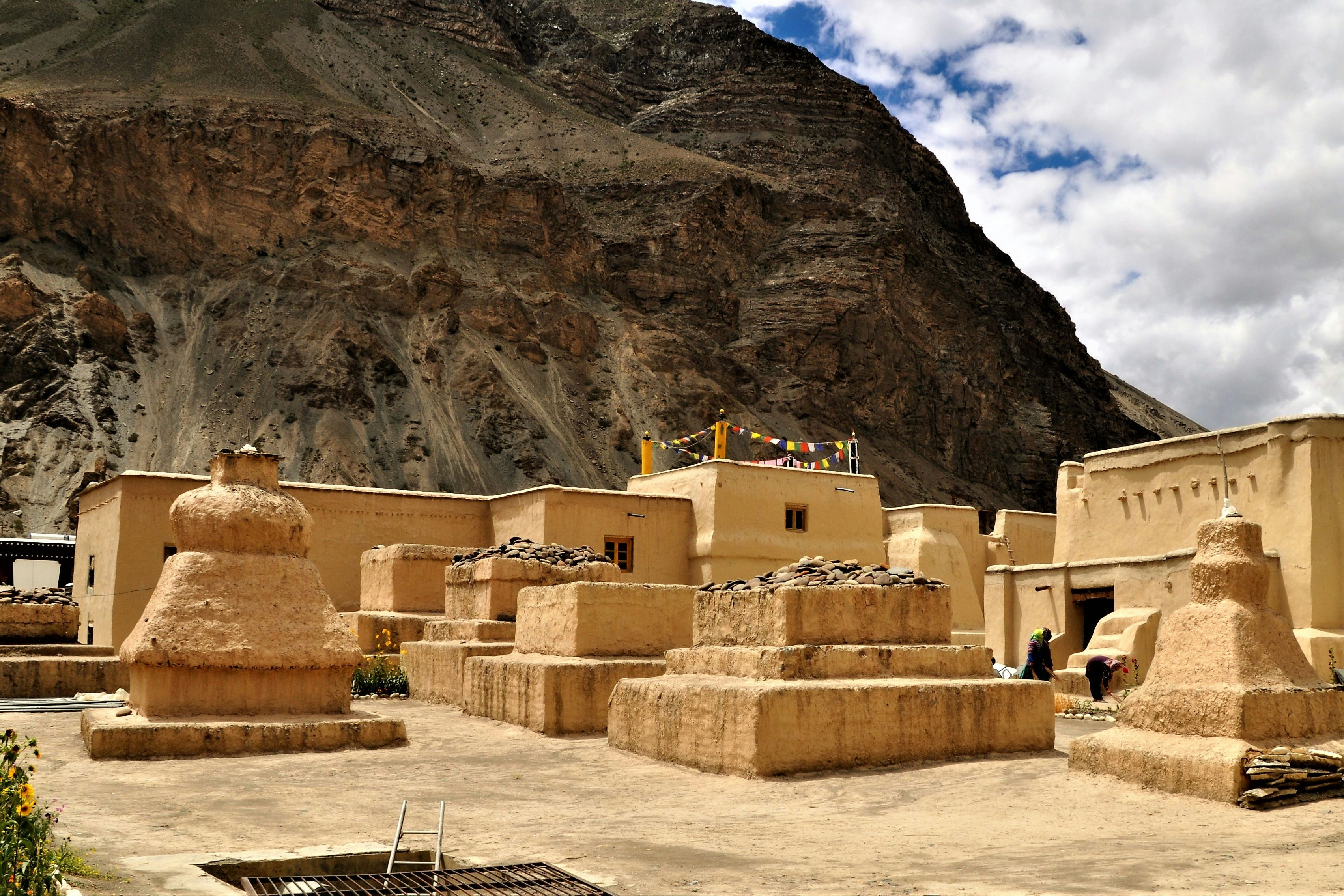 few people near historic tabo monastery under white and blue sky
