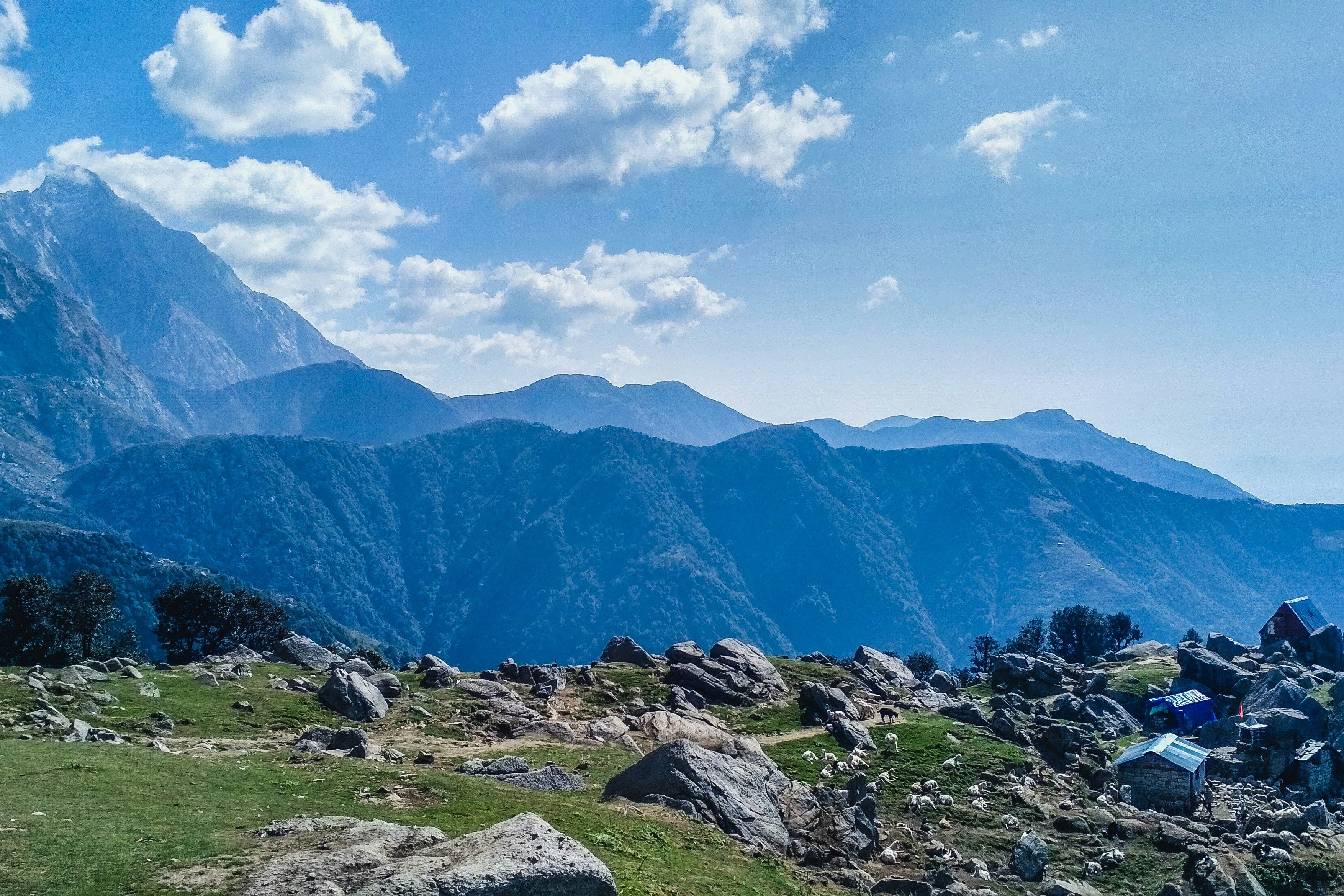 green and brown mountains under blue sky during daytime