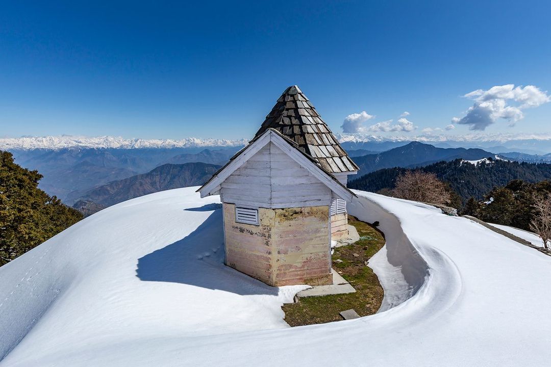 view of snow covered hatu peak in shimla