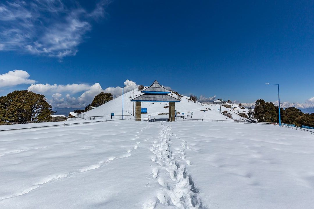 view of snow covered hatu peak in shimla
