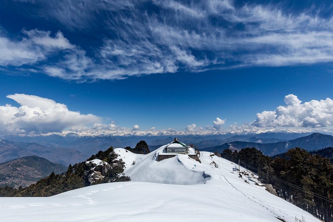 view of snow covered hatu peak in shimla
