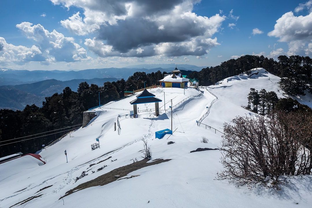 view of snow covered hatu peak in shimla