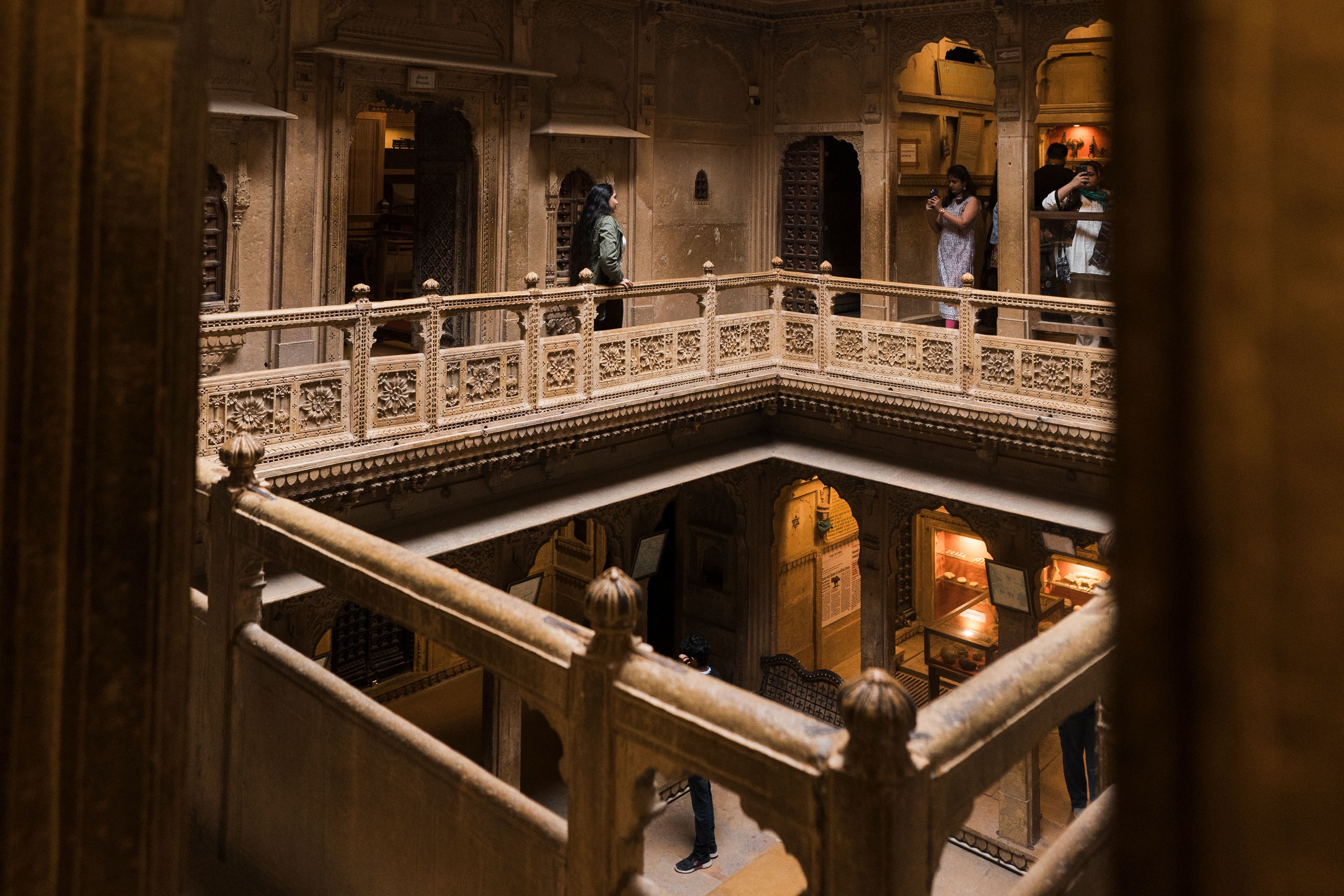 courtyard of historic patwon ki haveli courtyard with visitors exploring the ancient structure