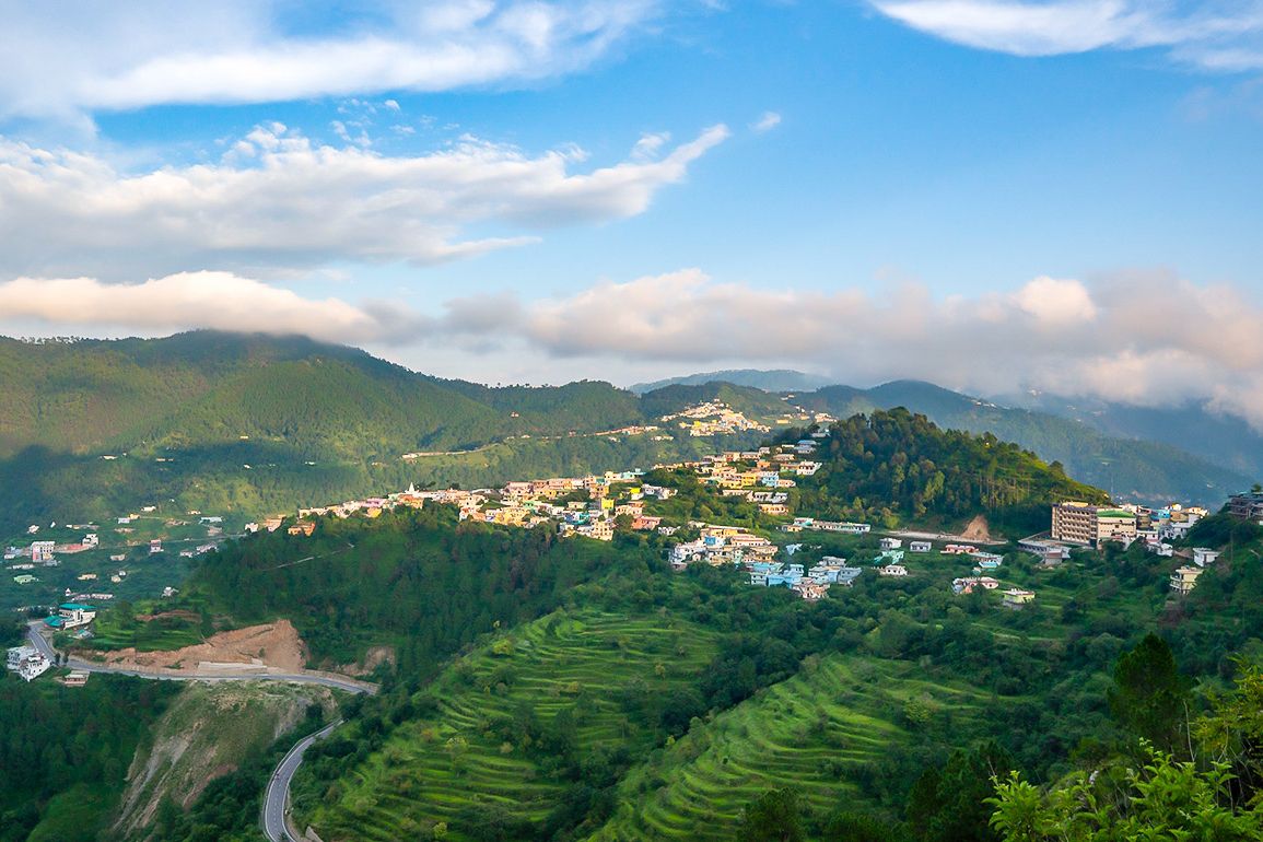 houses on top of a hill in chamba