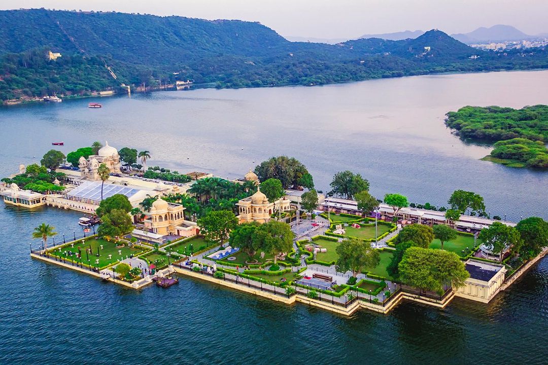 view of jag mandir palace surrounded by a lake in udaipur