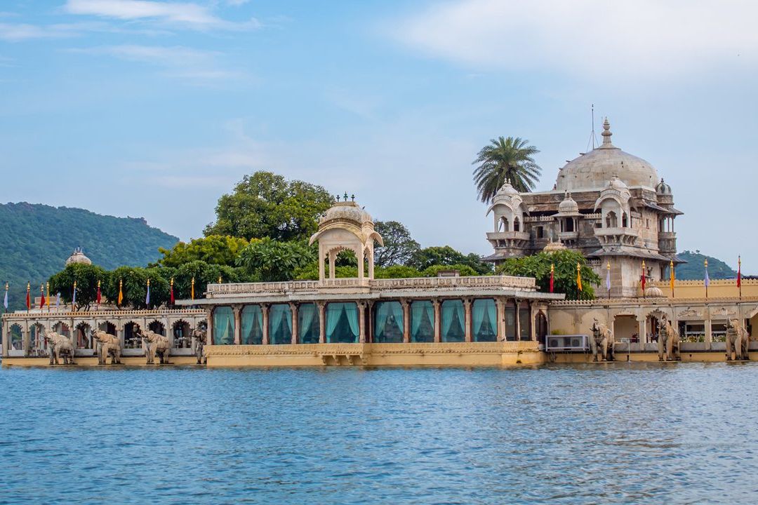view of jag mandir palace surrounded by a lake in udaipur
