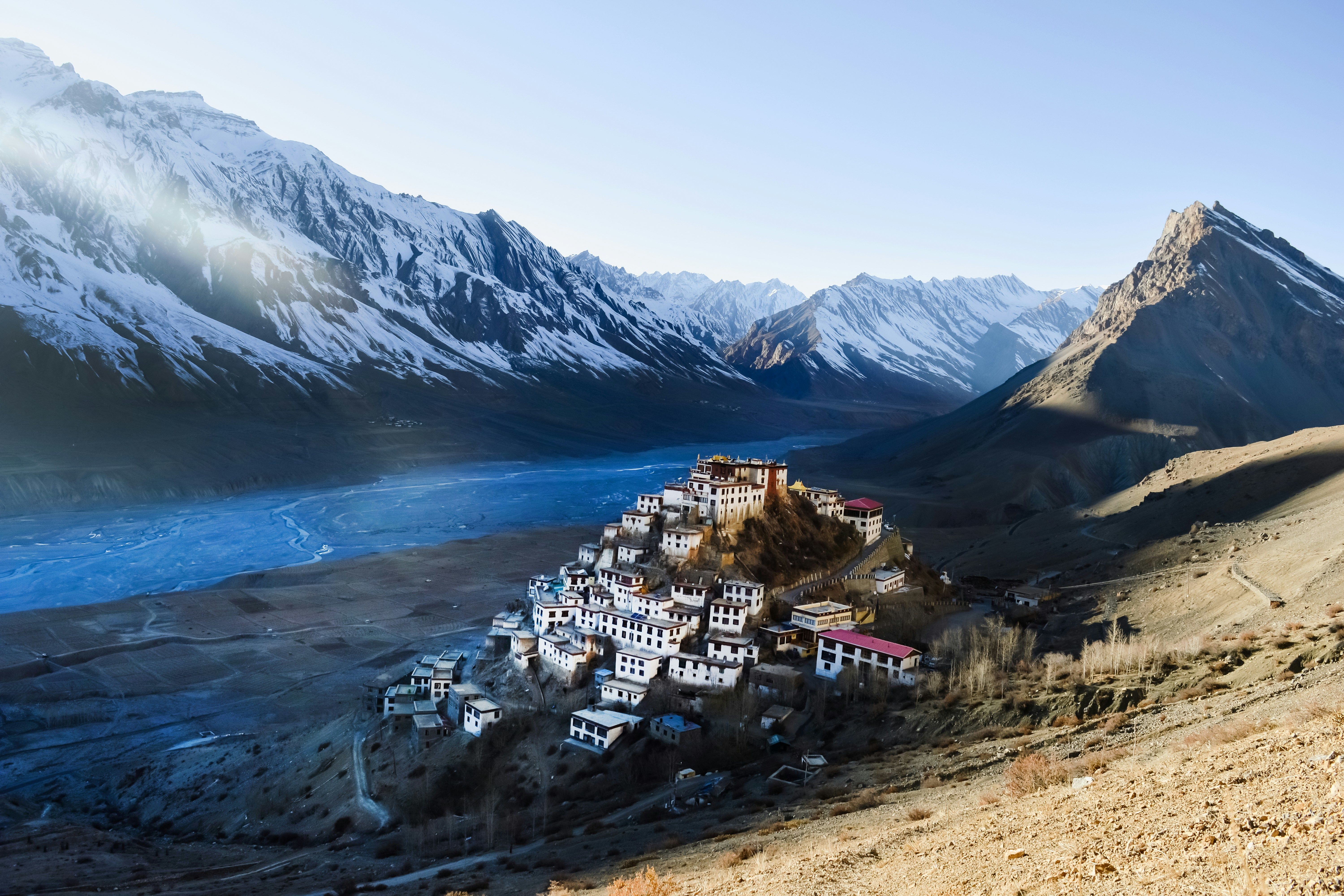 view of key monastery nested between majestic snowy peaks