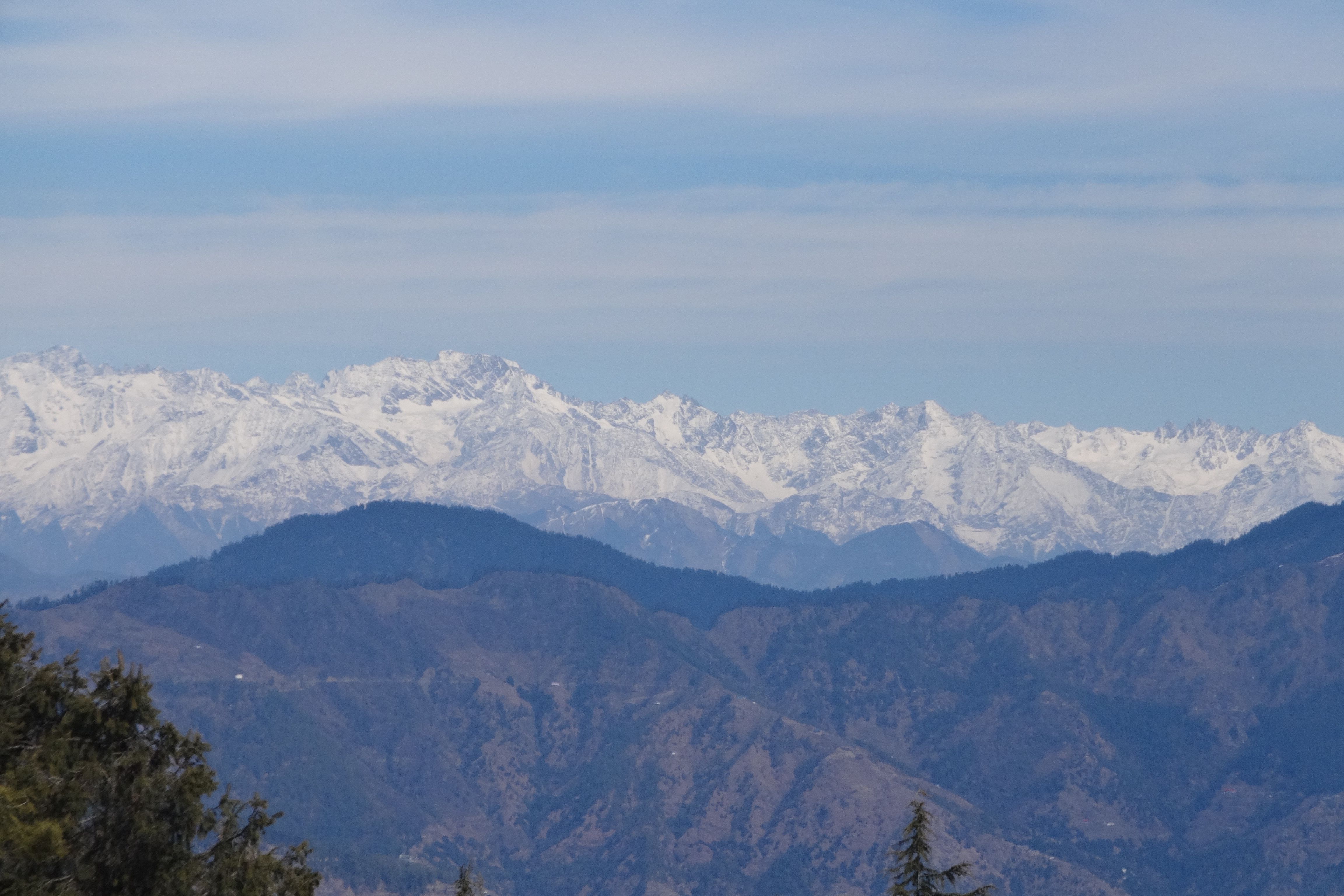 mountains covered with snow near kufri daytime