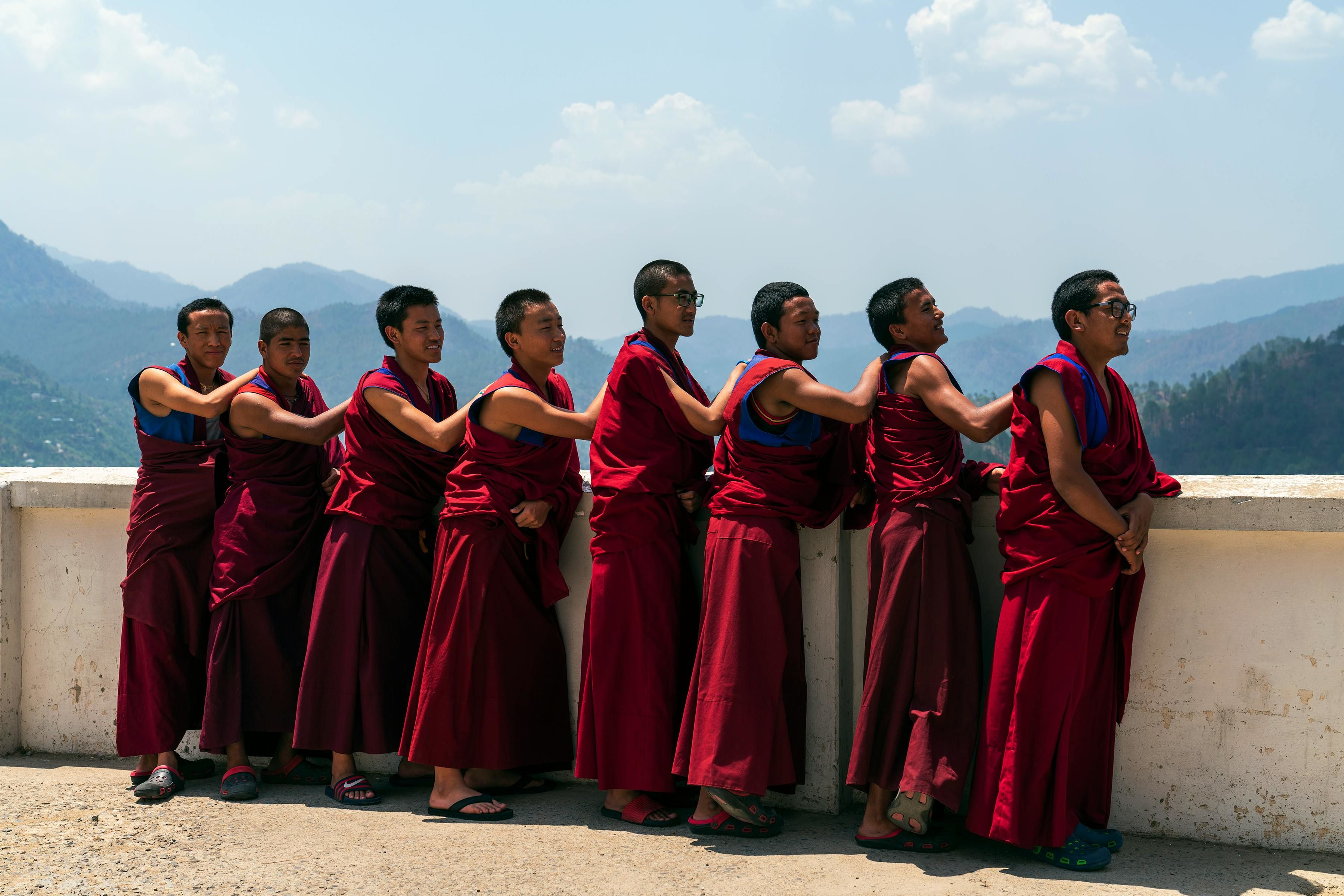 a line of buddhist monks in dharamshala