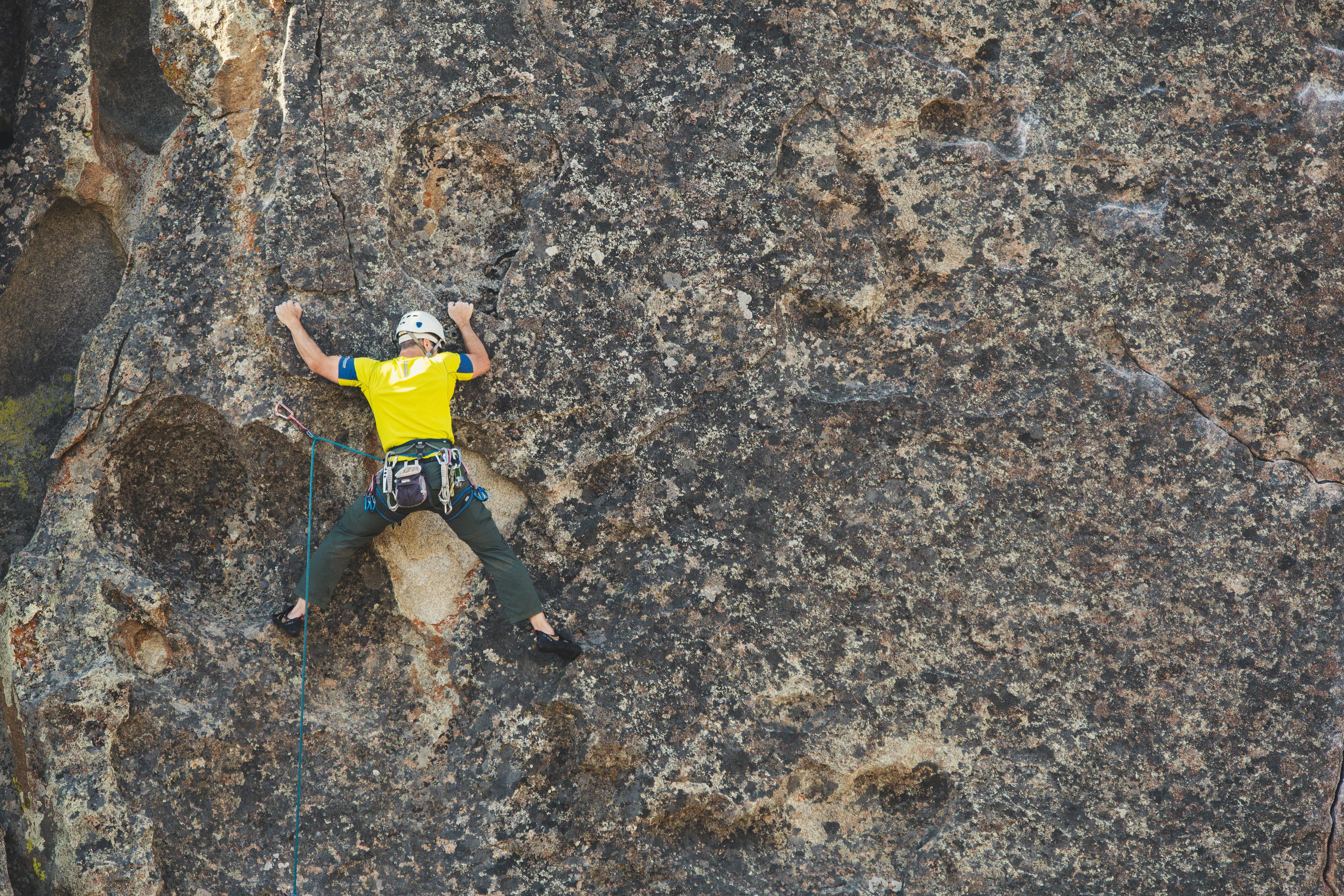 a person doing outdoor rock climbing