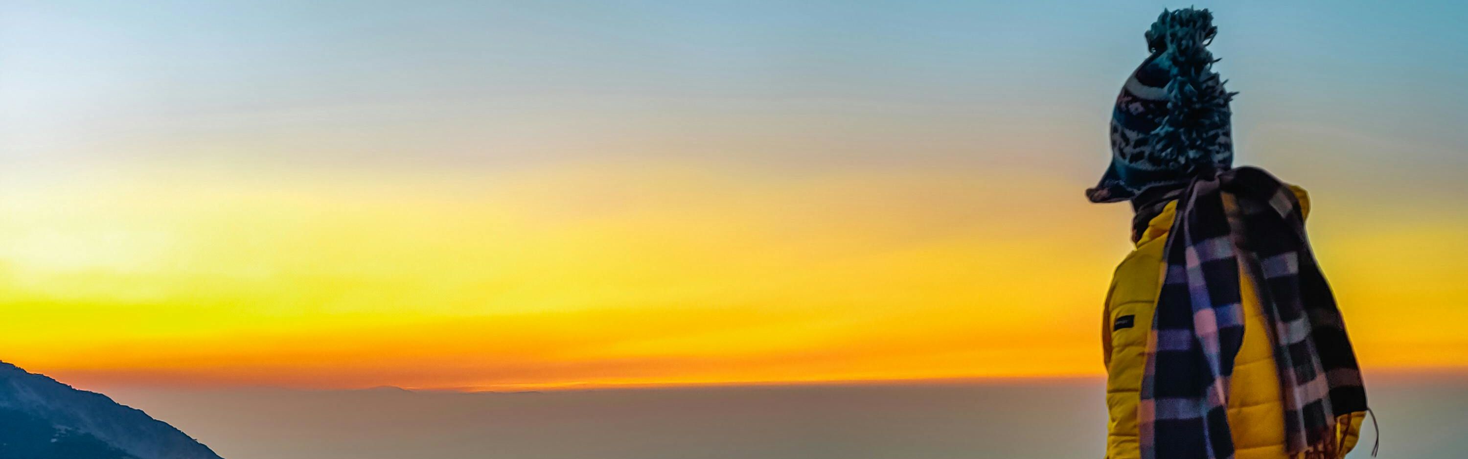 a man standing on the mountains