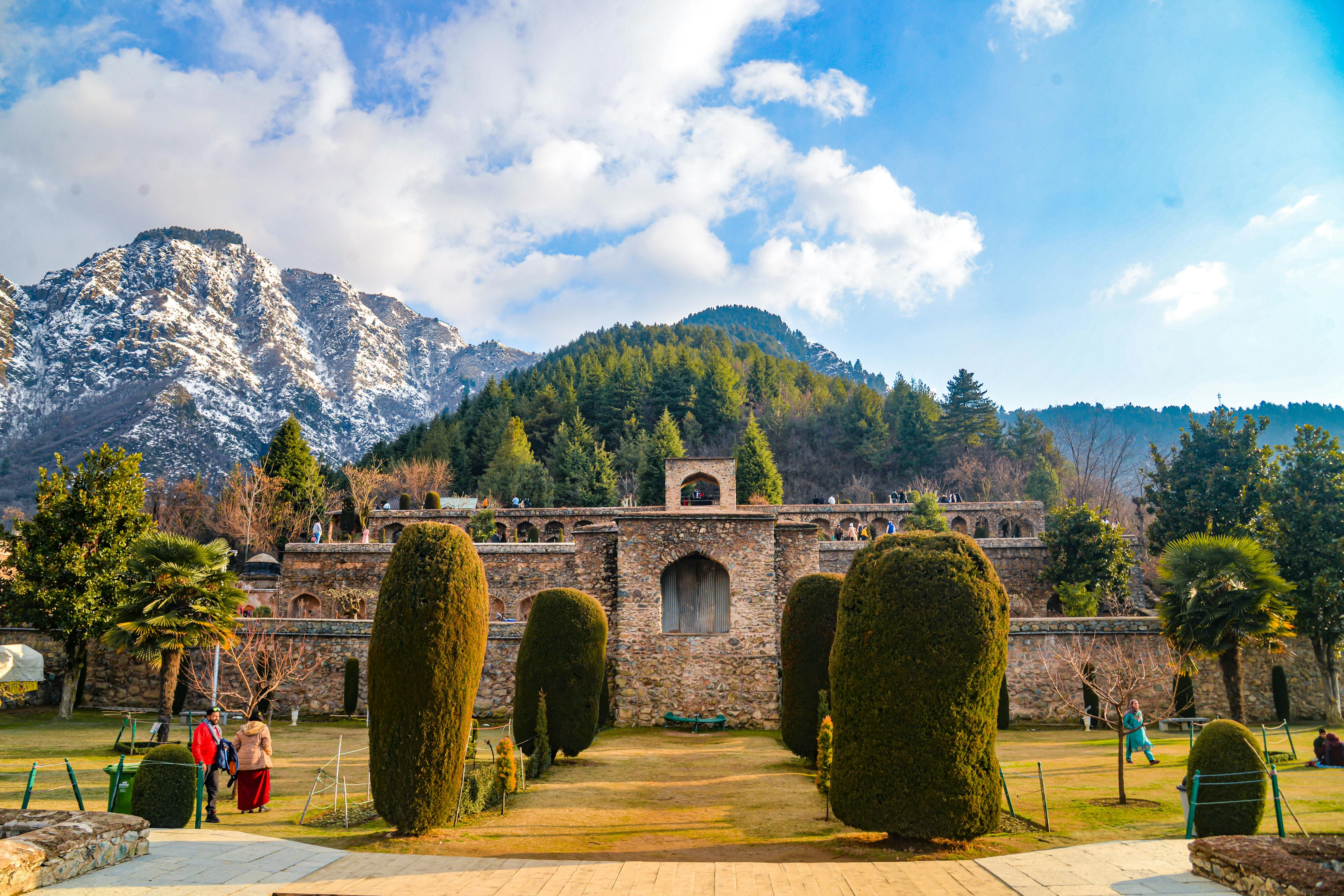 view of pari mahal with hill and mountains in the background