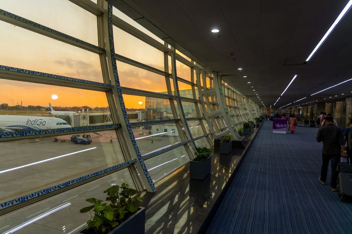 people walking inside jaipur international airport during evening