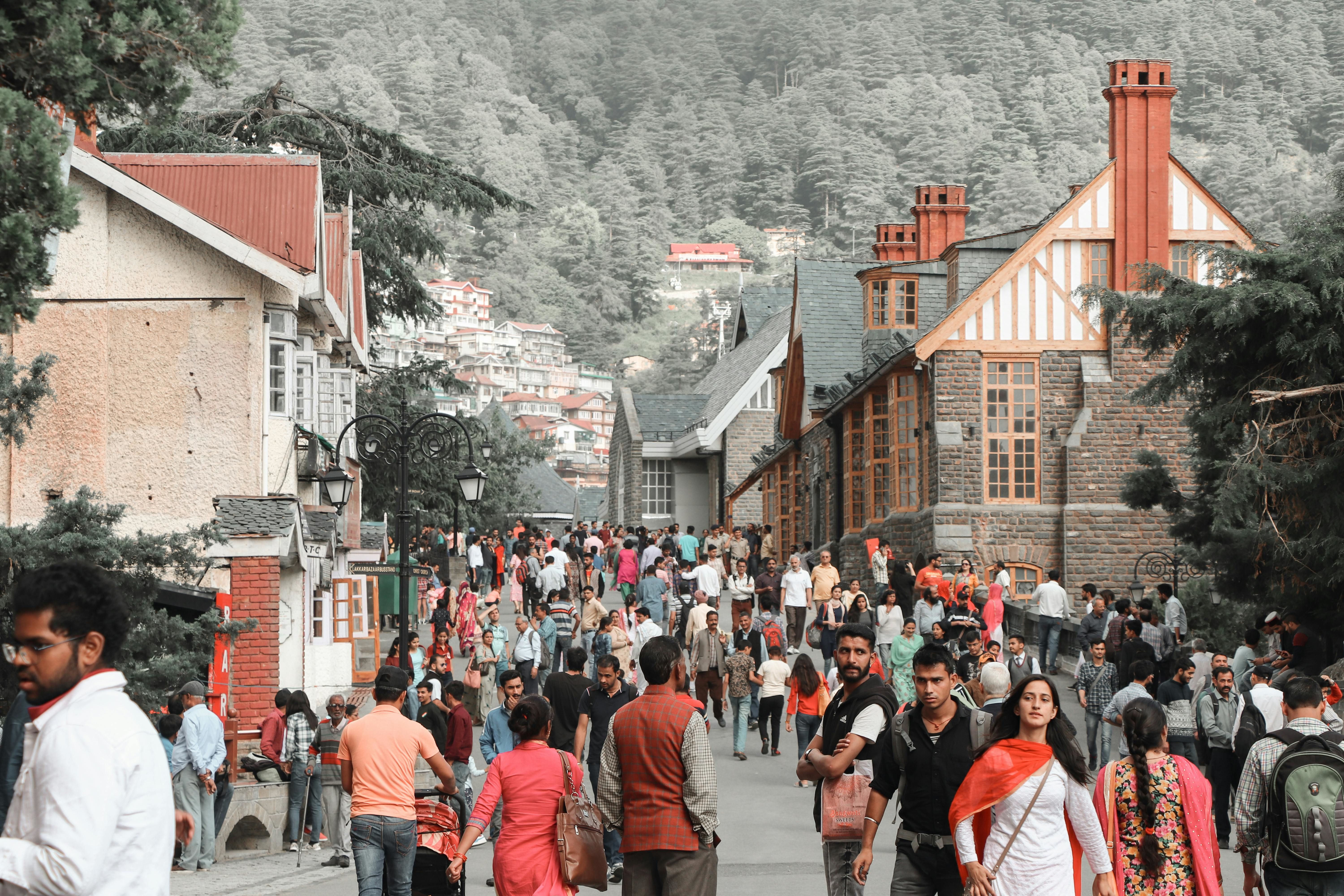 people walking on a street in shimla