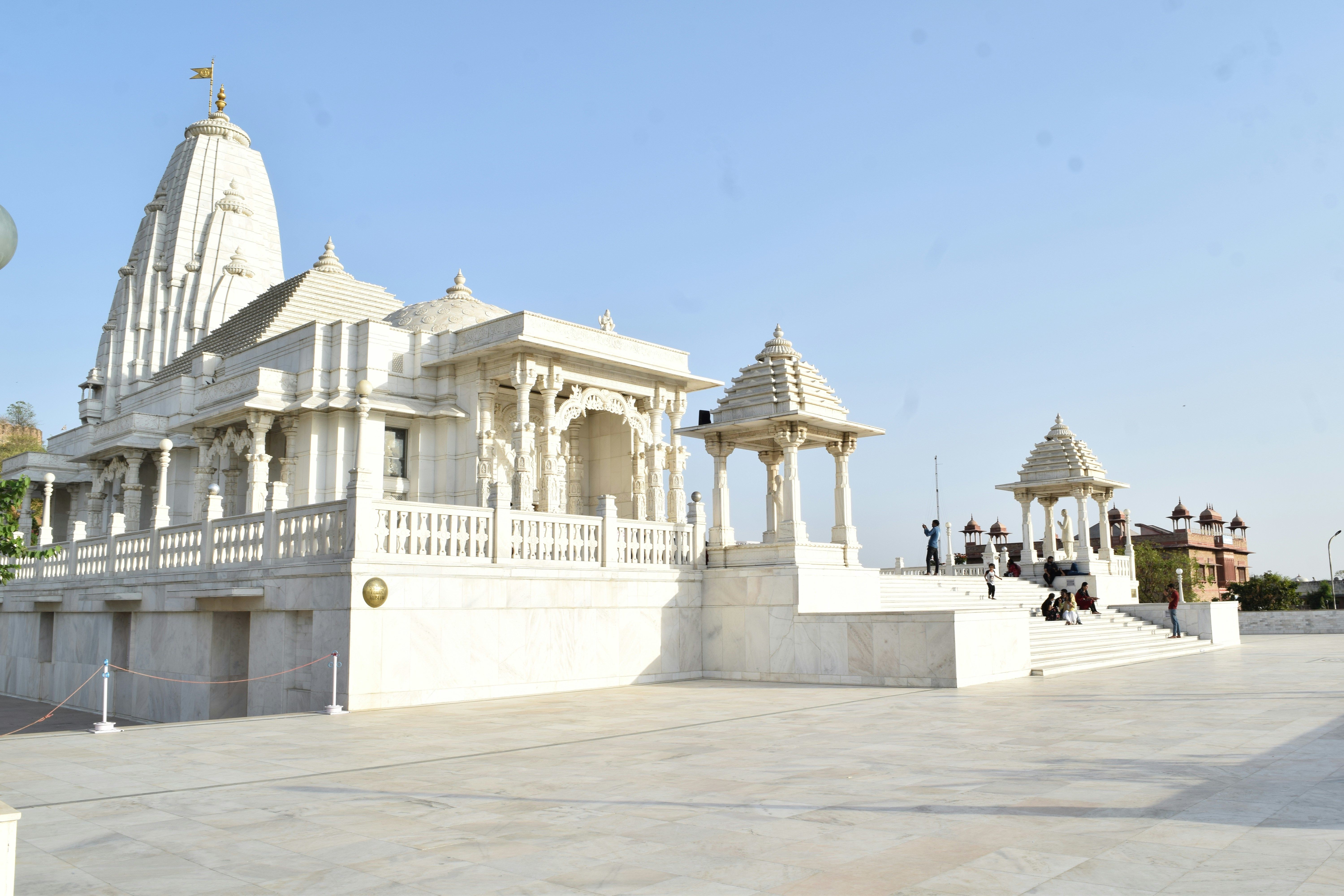 people walking on white stairs of birla temple in jaipur during daytime