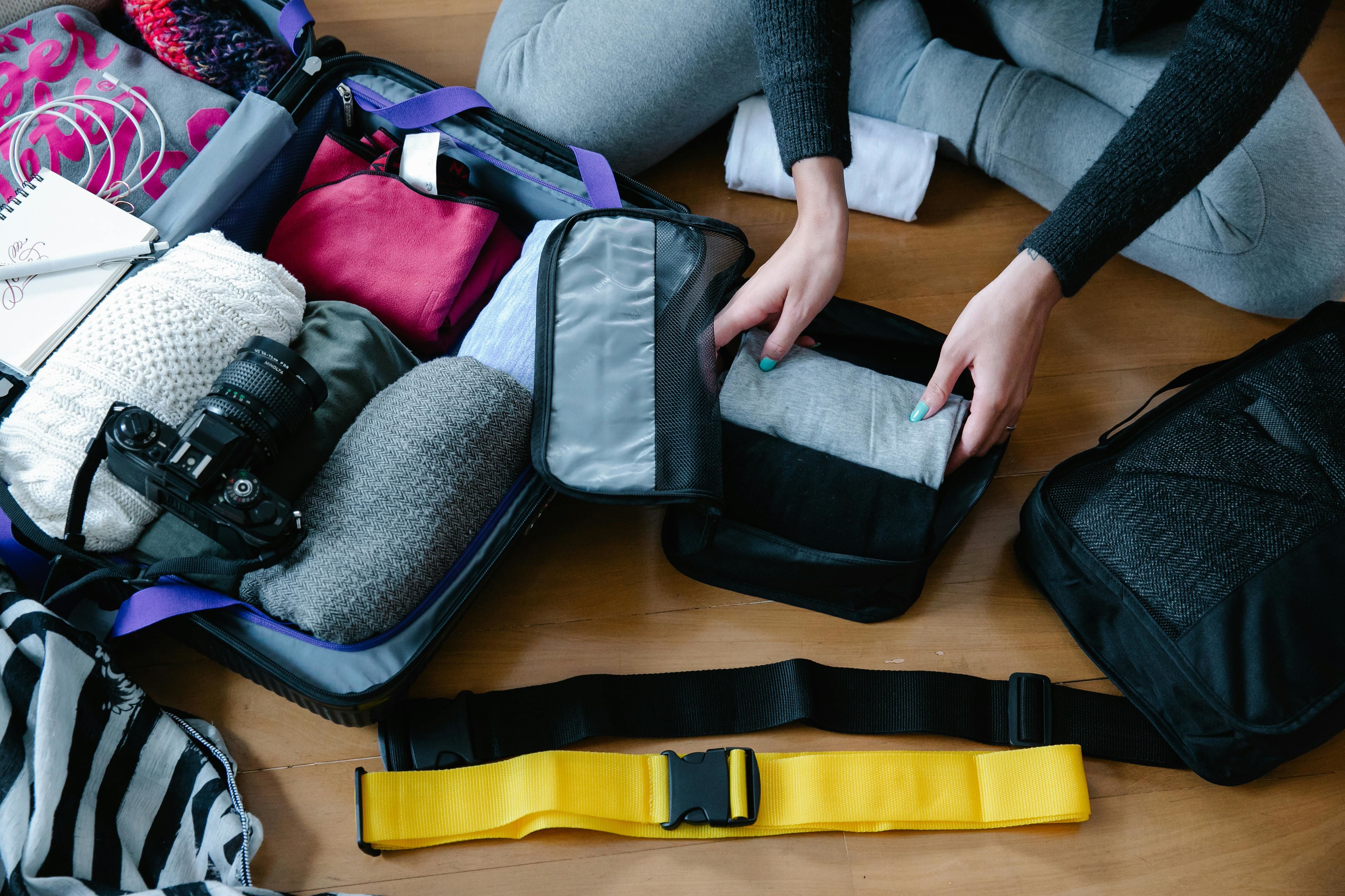 a person packaing clothes
