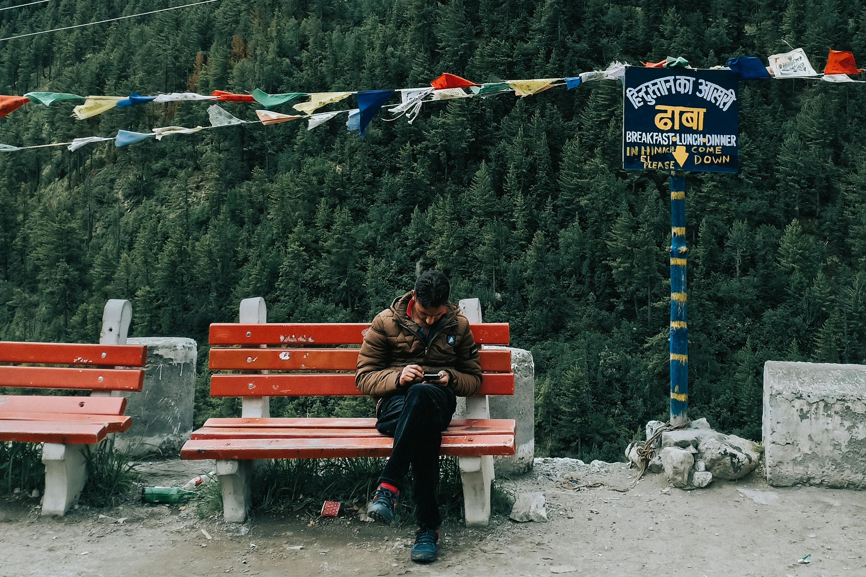 a person sitting on bench