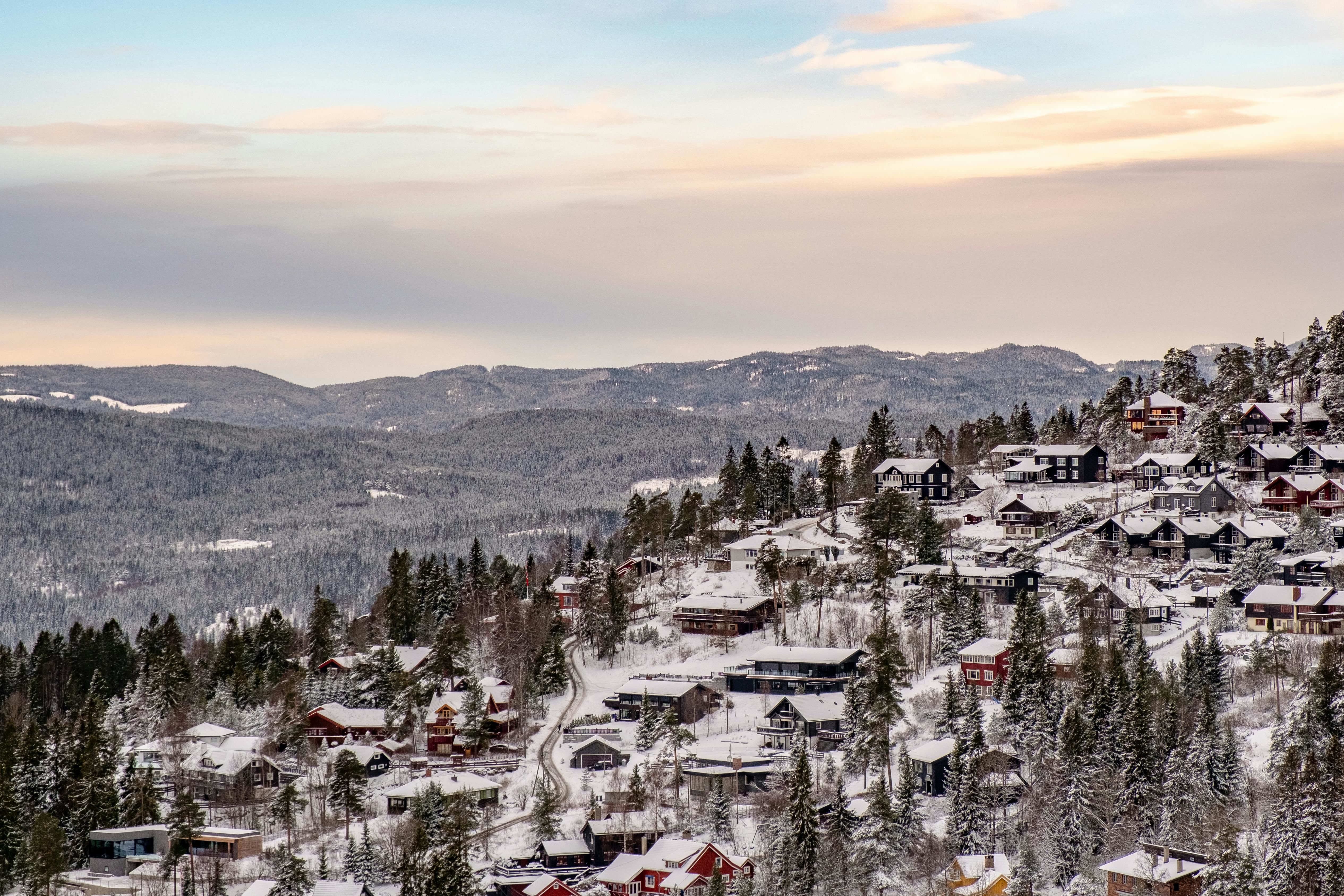 white snow on the roof of houses in a town