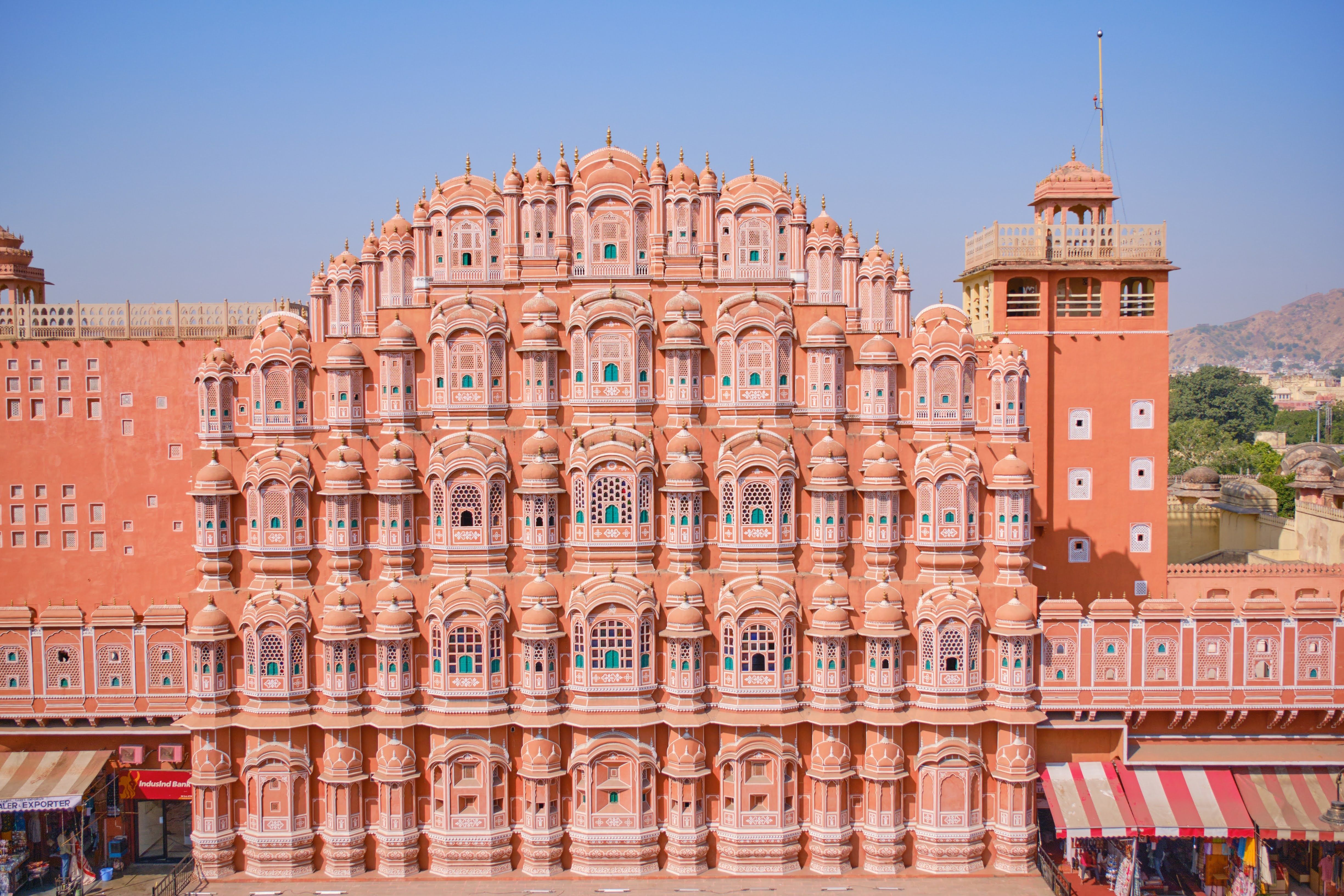 red facade of hawa mahal in jaipur