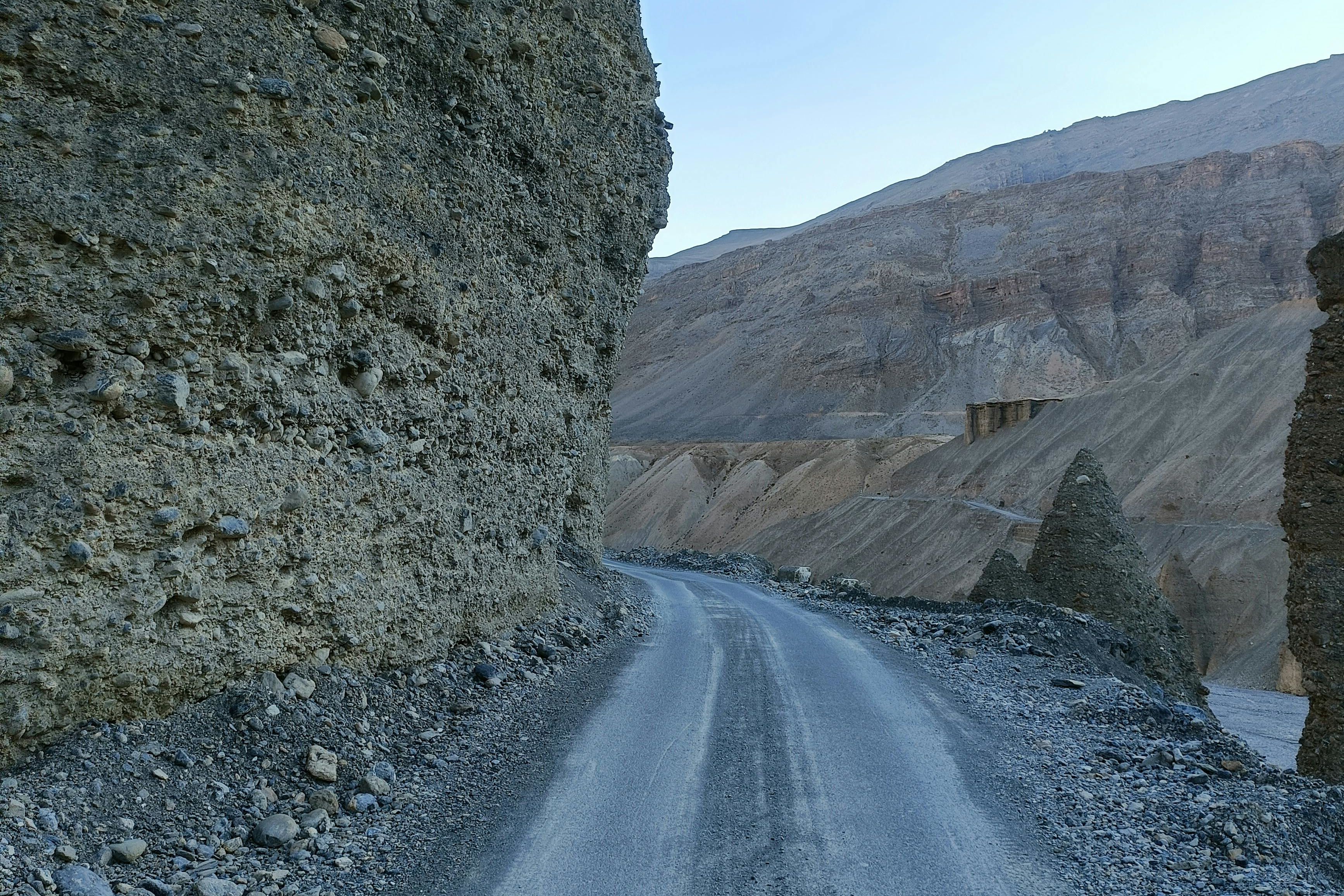 a scenic road through spiti valley rugged terrain