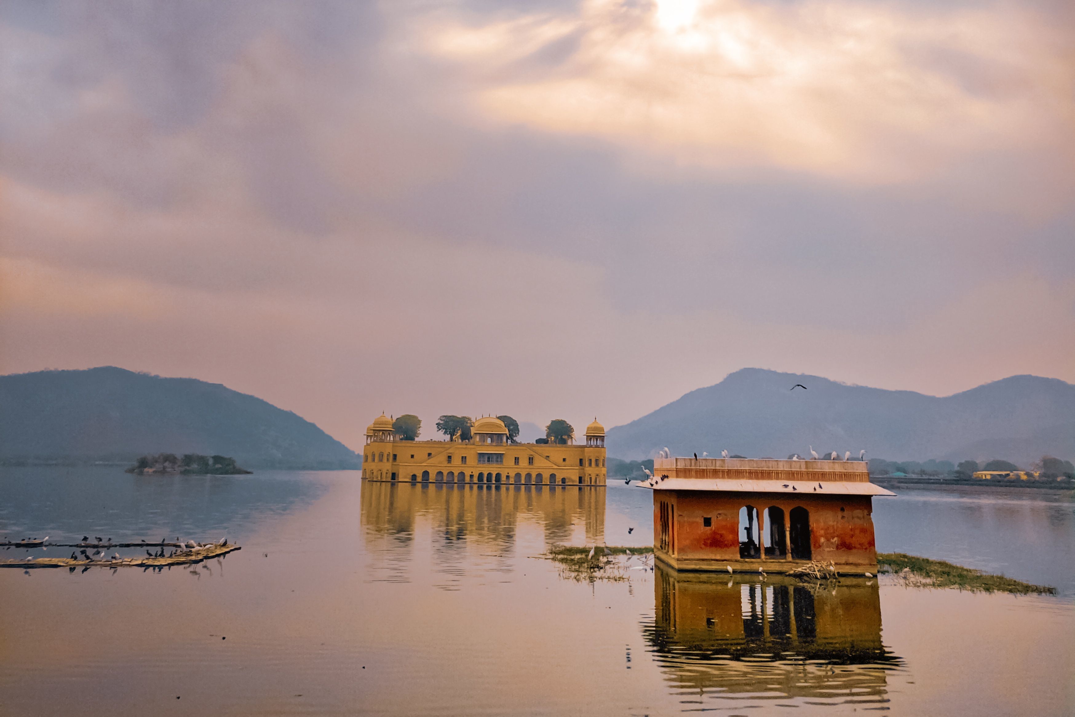 scenic view of jal mahal at sunset reflecting over man sagar lake in jaipur