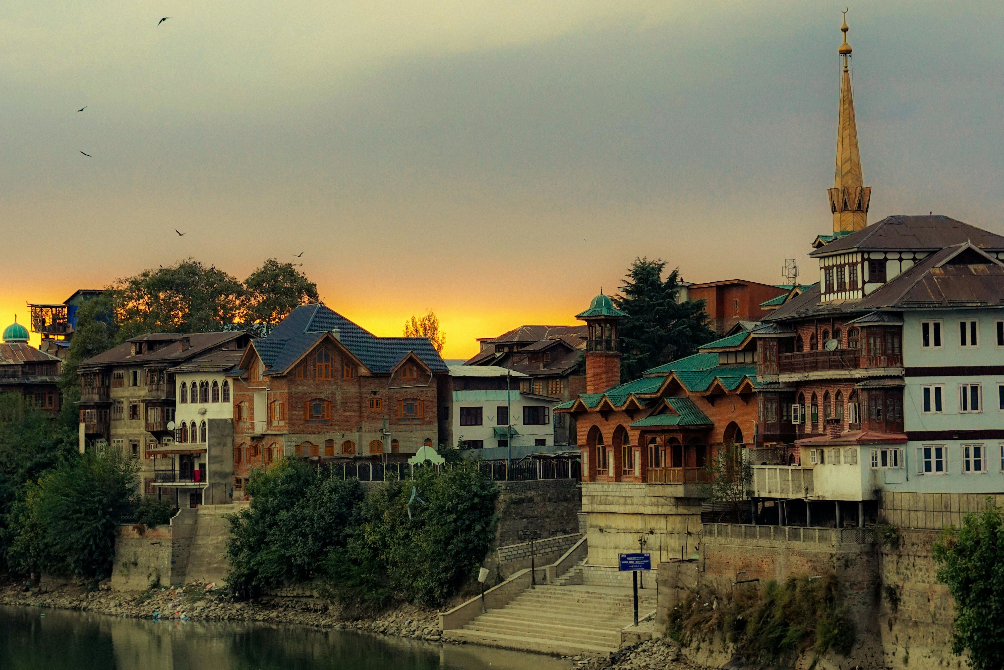 scenic view of a traditional house in srinagar at sunset