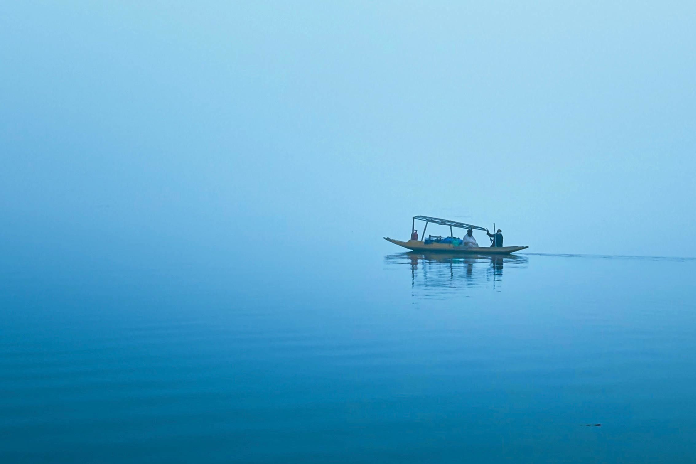 serene boat ride on misty dal lake