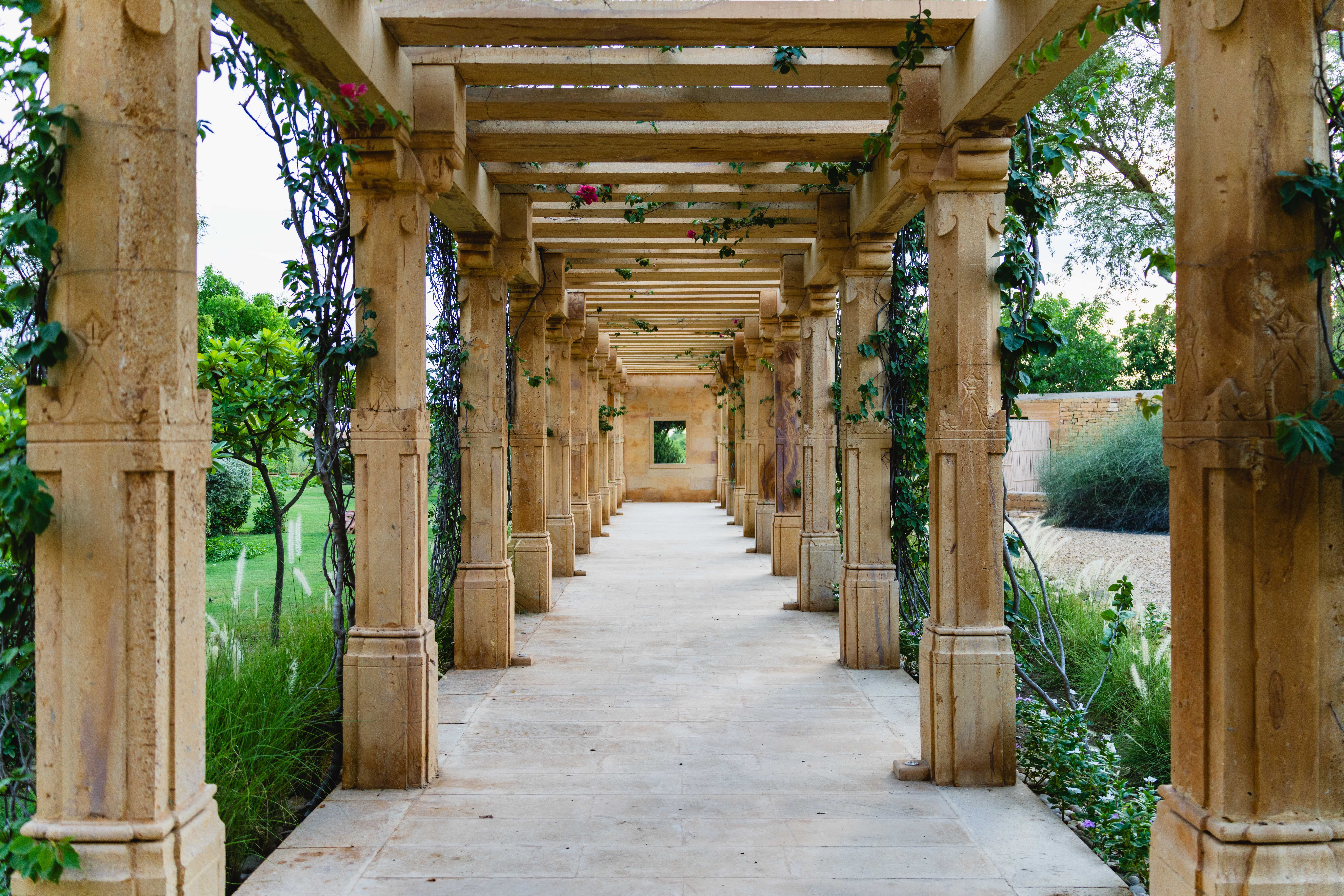 stone pillar garden pathway in jaisalmer rajasthan