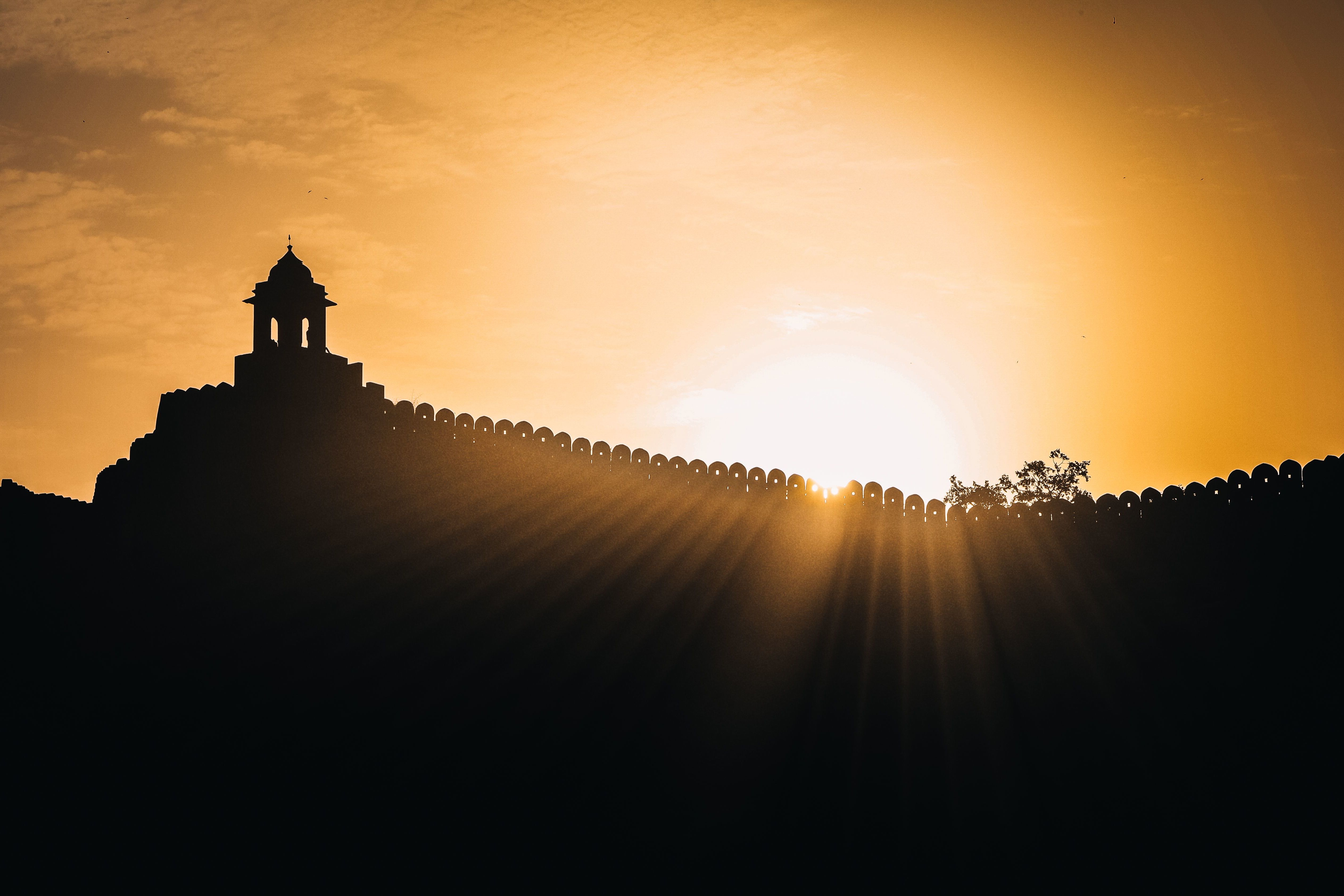 silhouette of nahargarh fort in jaipur during sunrise