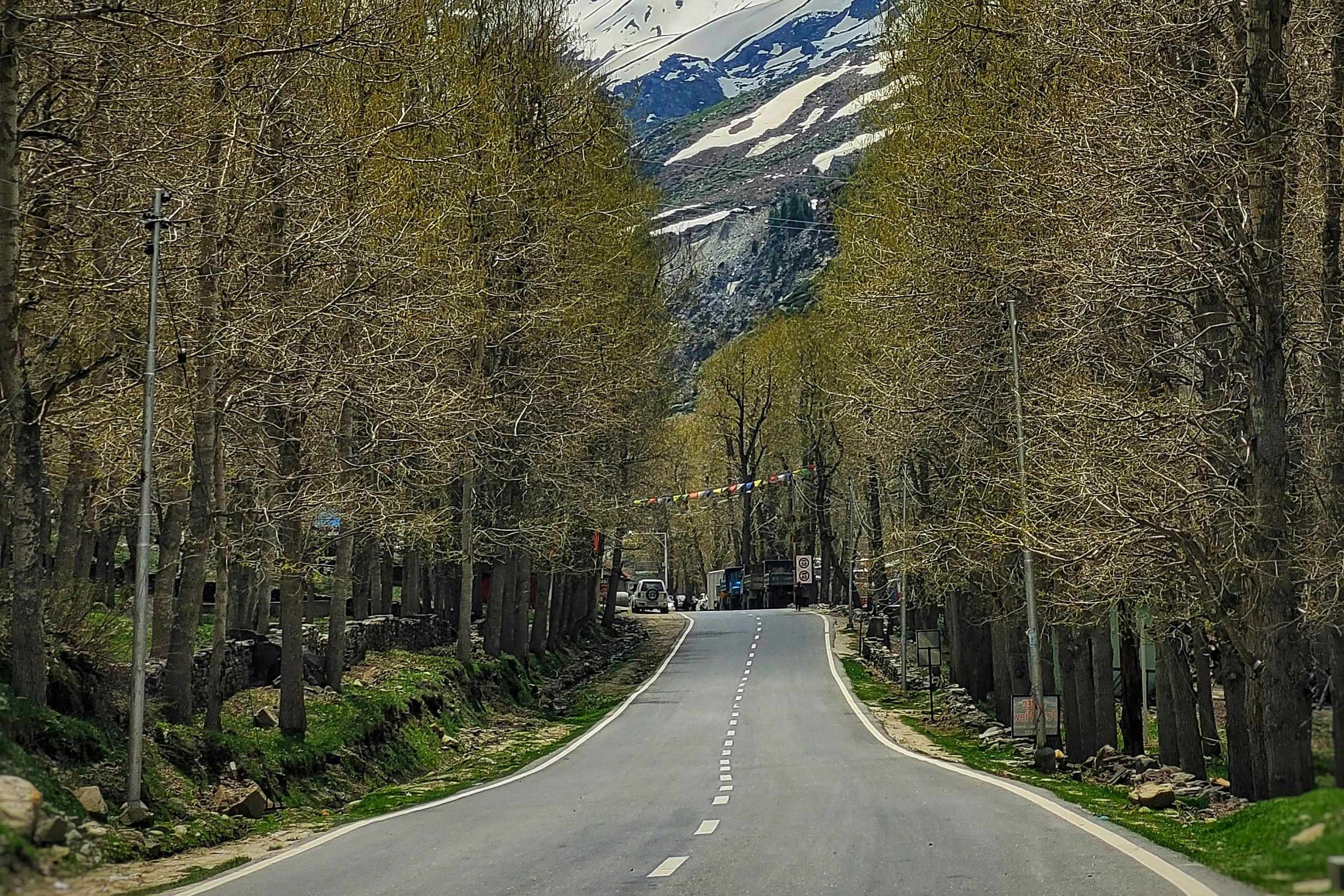 a road passing near sissu town in himachal pradesh